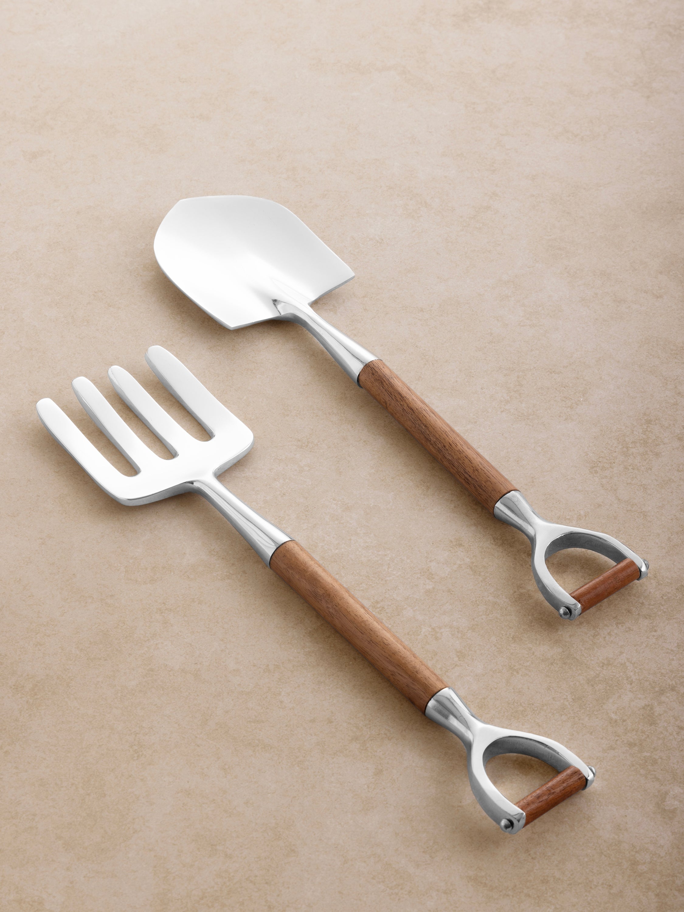 Salad servers with wood handles and polished silver heads in fork and spade design — elegant serveware