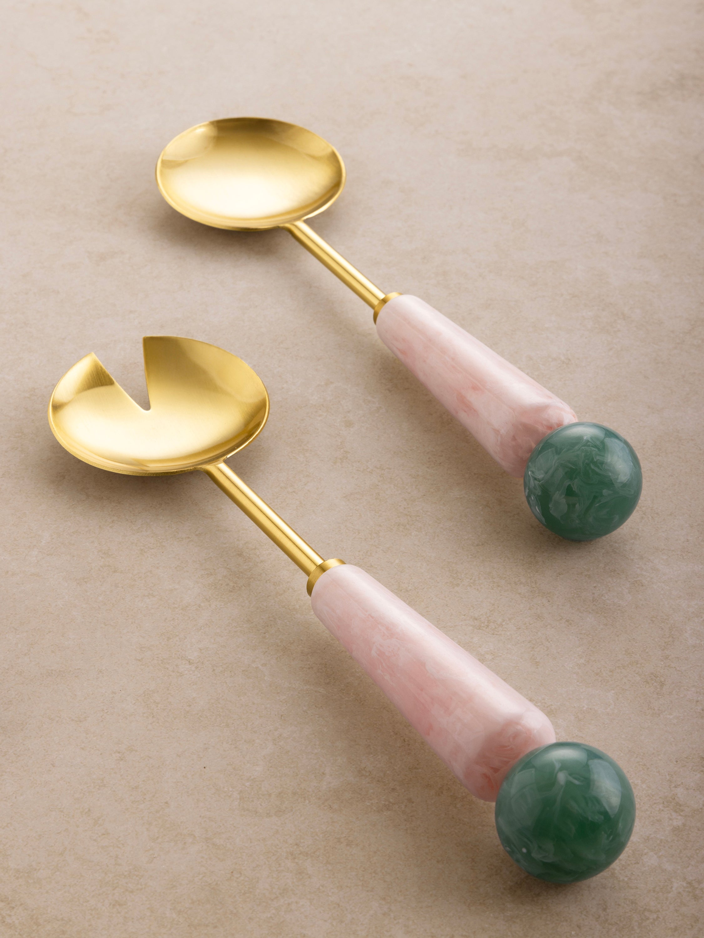 Pink and green resin handle salad servers in matte gold — stylish entertaining essential