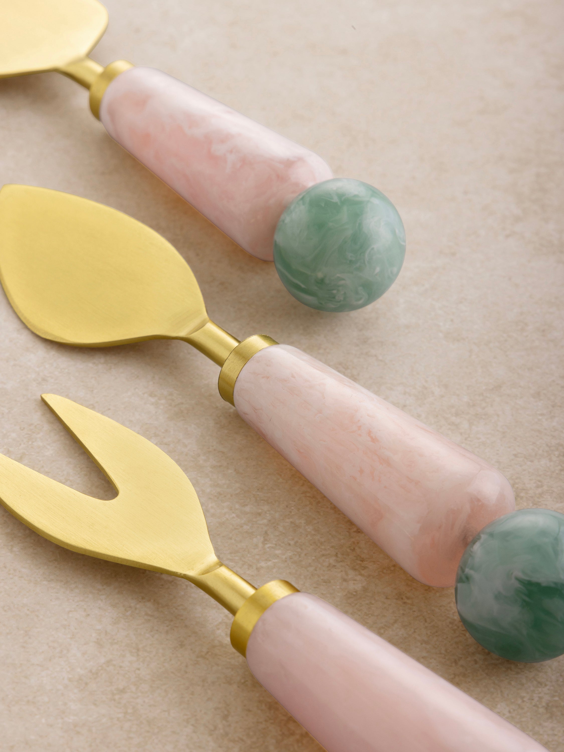 Gold cheese knife trio with resin accents — modern handcrafted dining essential