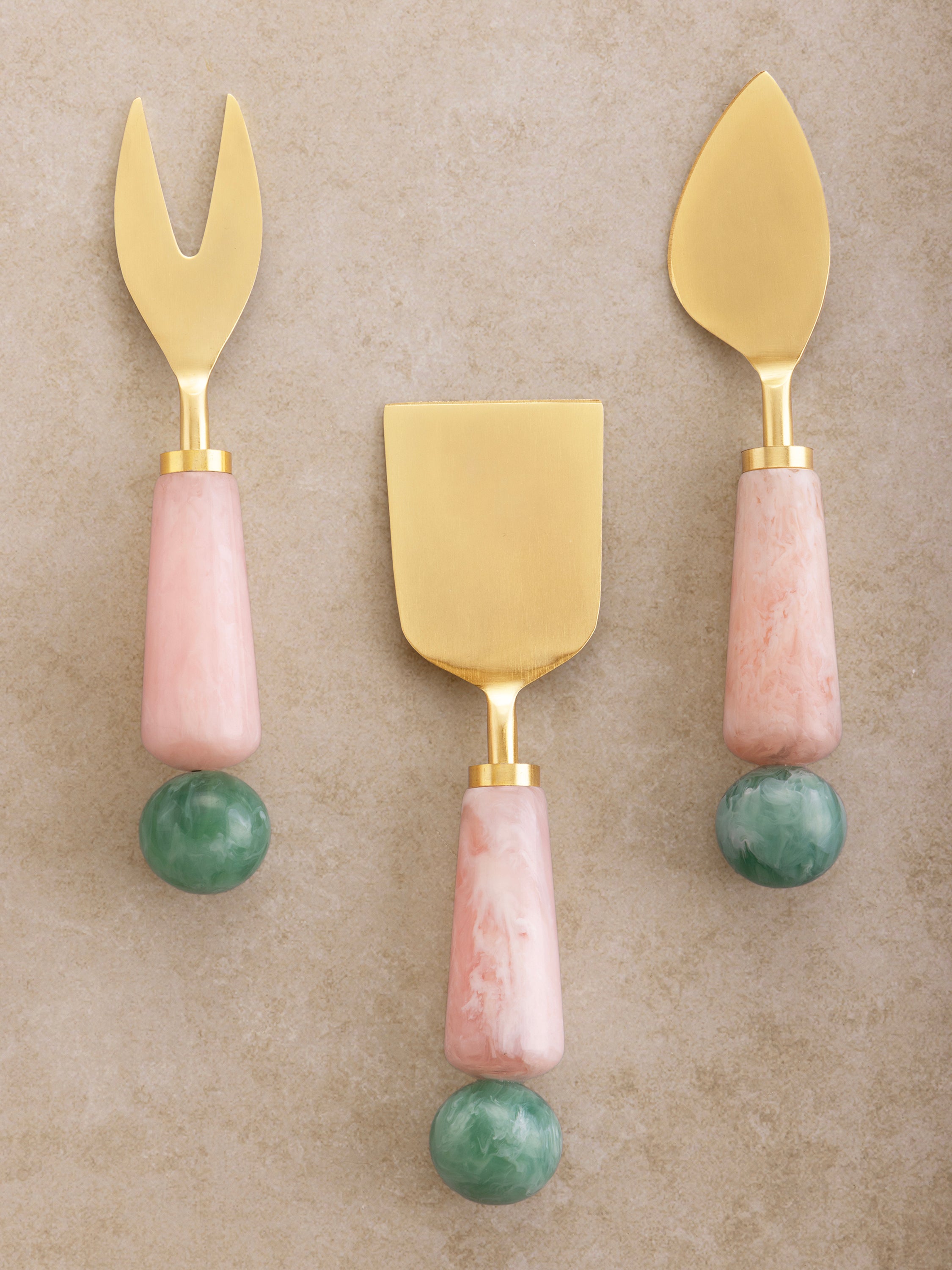 Gold cheese knives with pink and green resin handles — elegant handcrafted serveware set