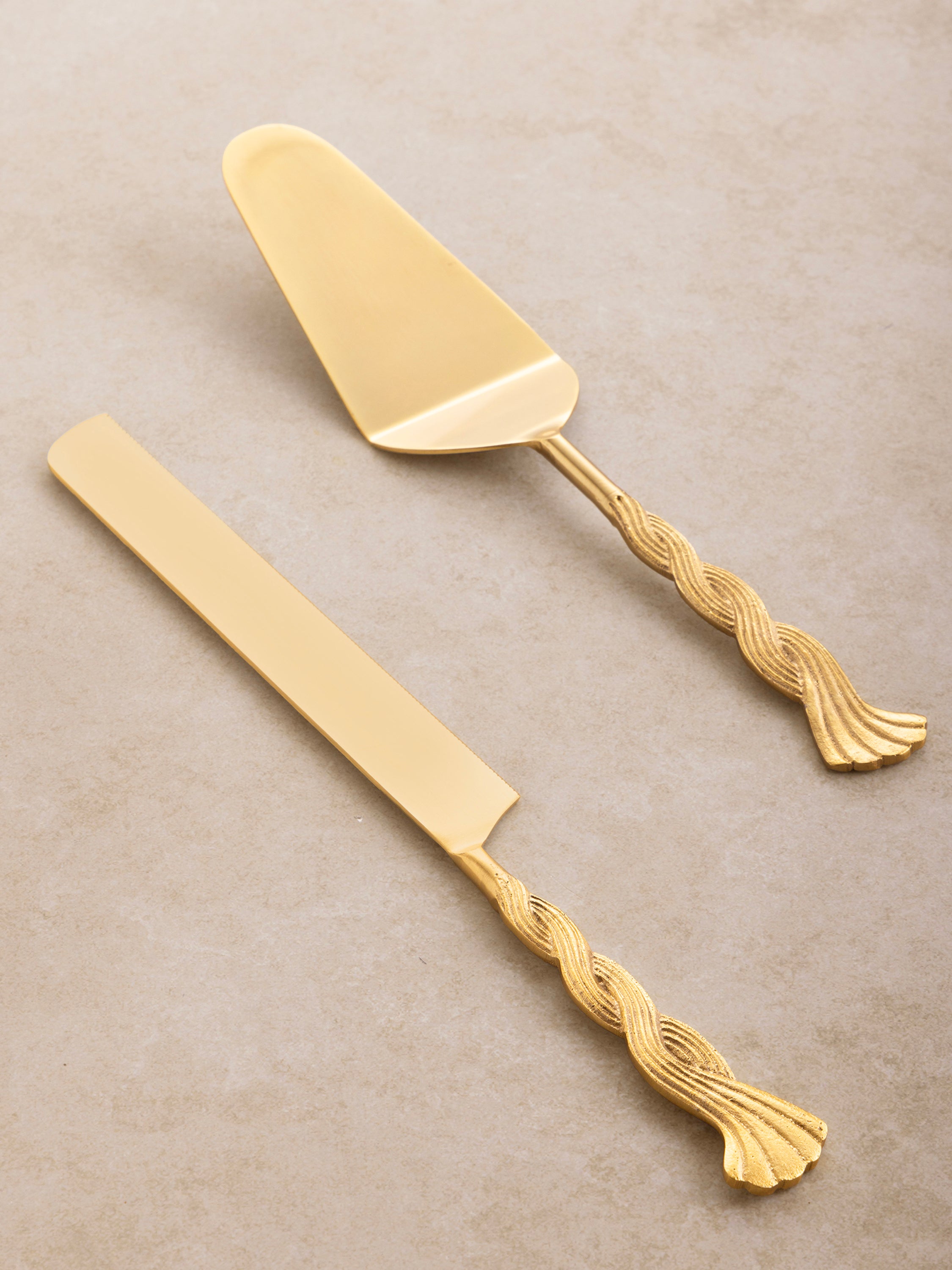 Cake knife and server in soft gold finish with rope-twisted handles — luxury dessert accessory