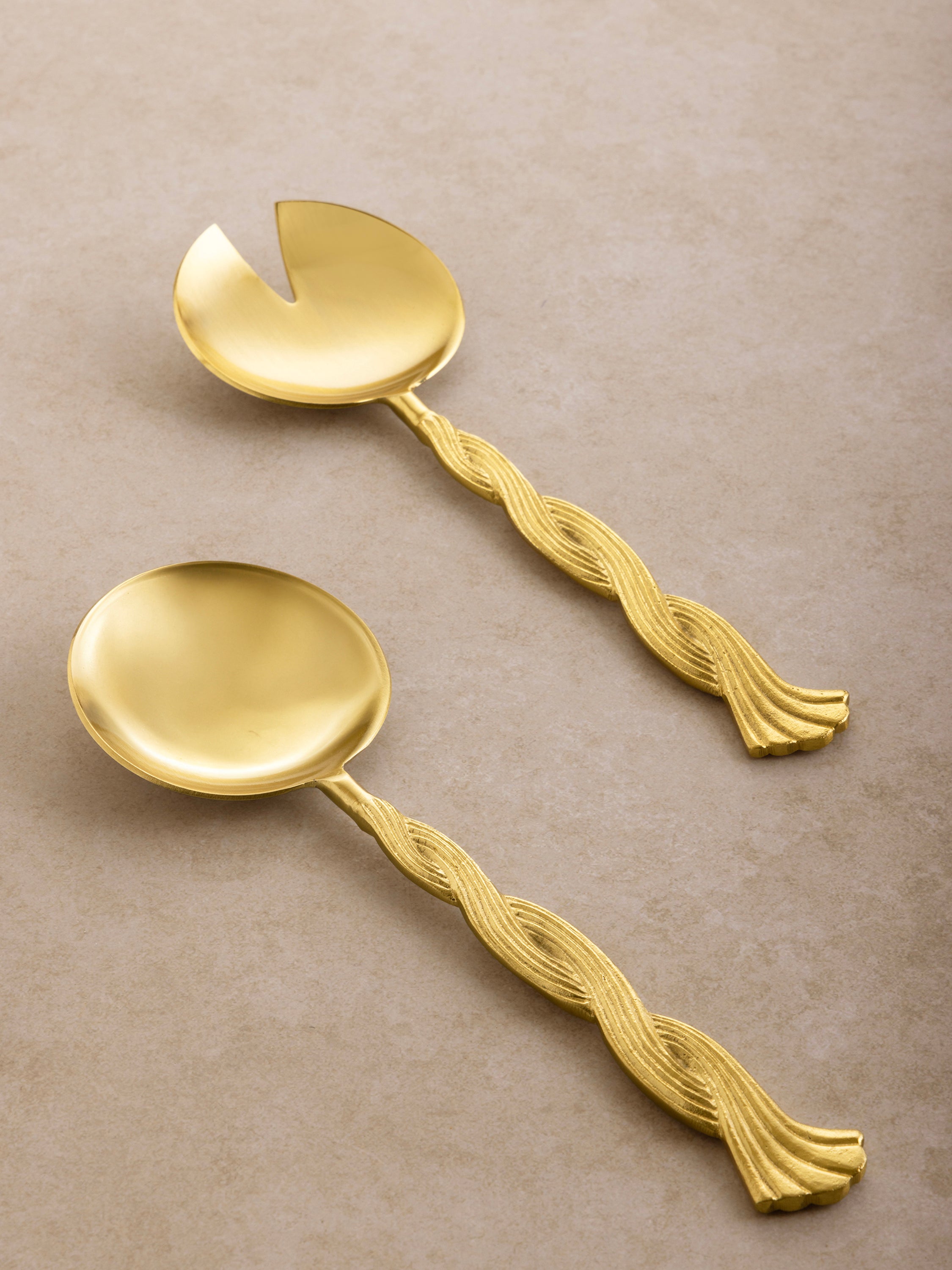 Twisted rope-style salad servers in matte gold — artisan handcrafted tableware