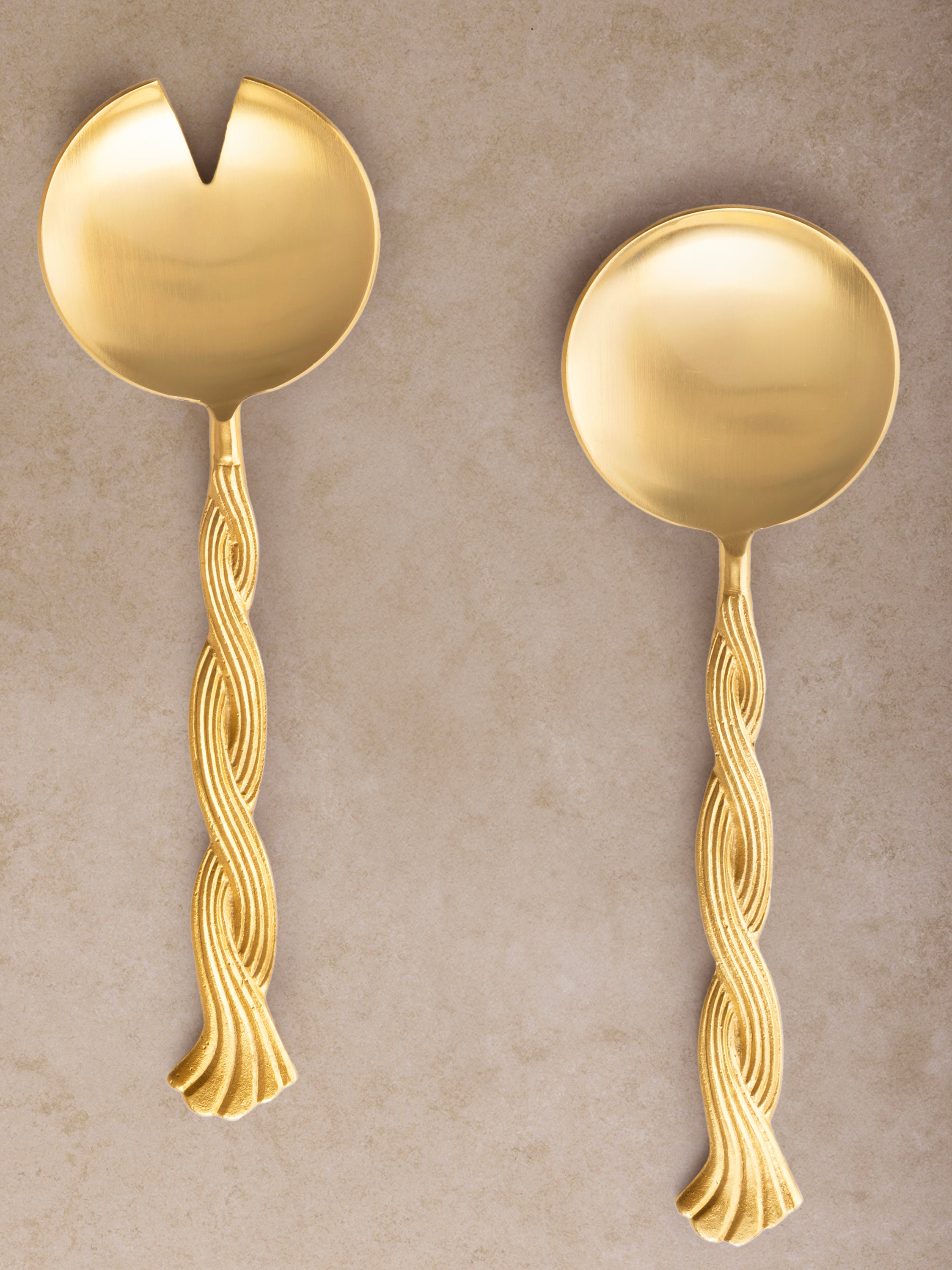 Matte gold salad servers with twisted handles — elegant modern serveware set