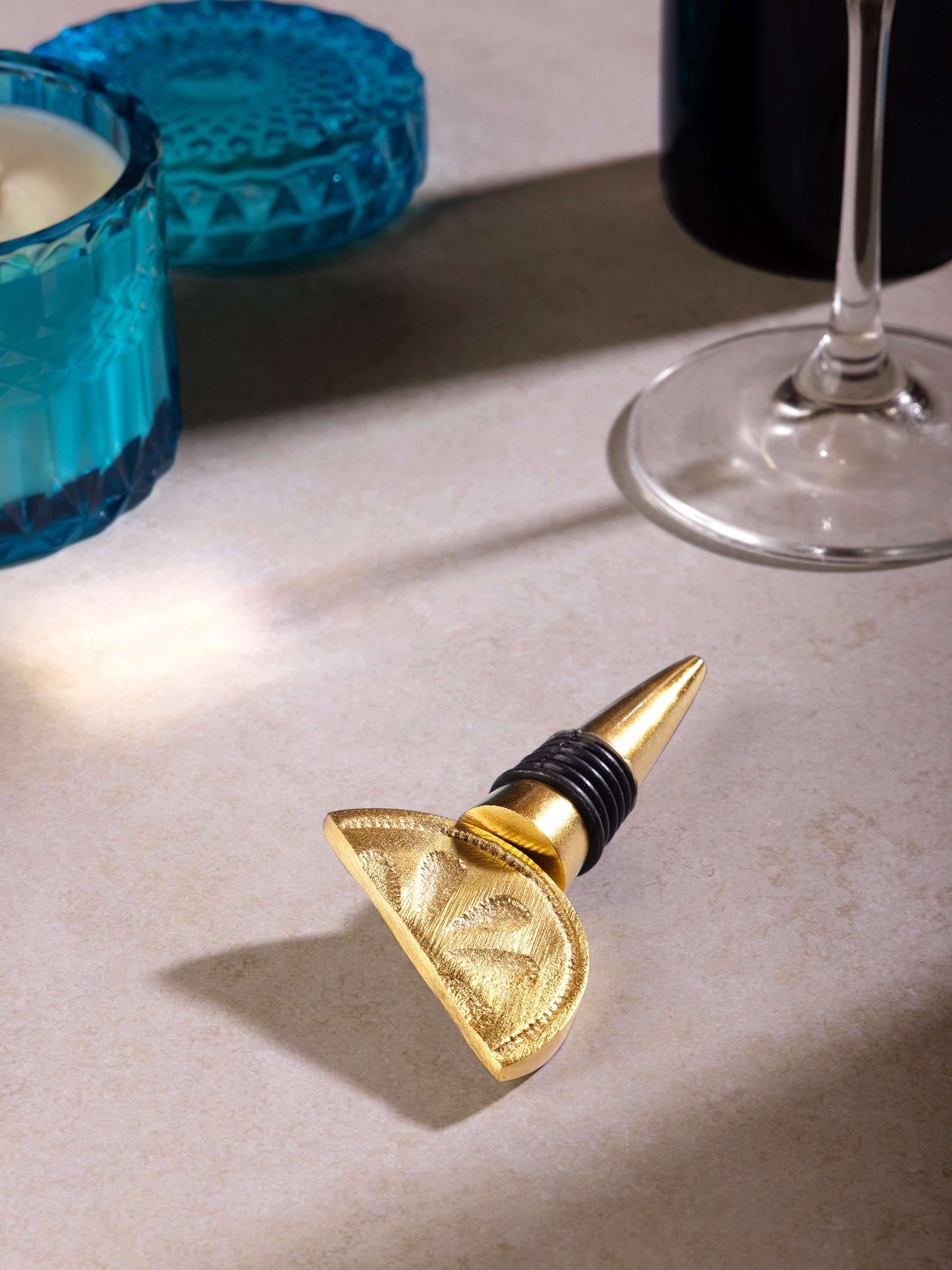 Artisan-made aluminum wine bottle stopper with soft gold tone — luxury entertaining piece