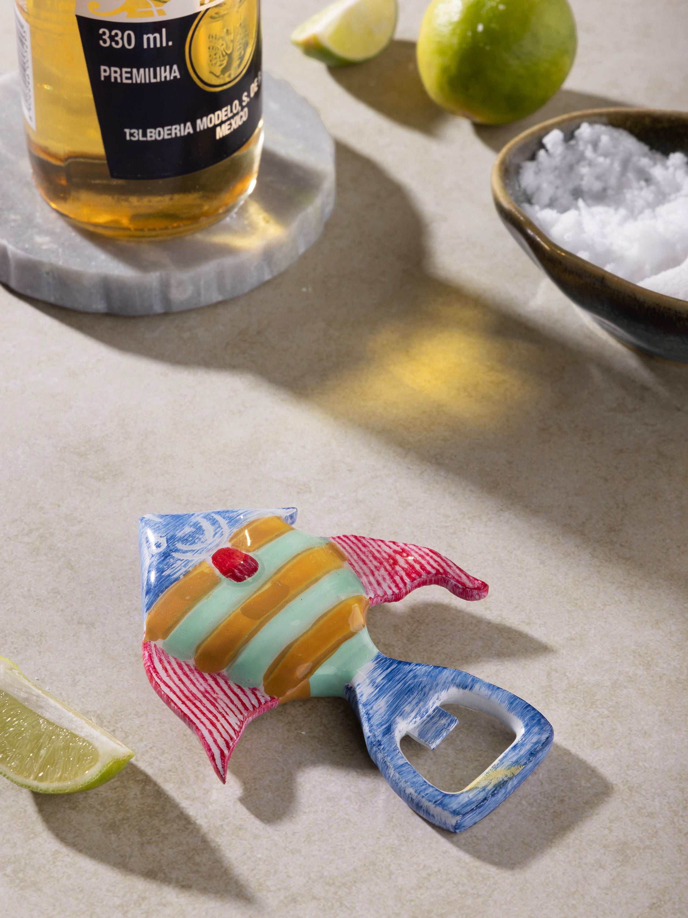 Vibrant ceramic bottle opener in the shape of a tropical fish