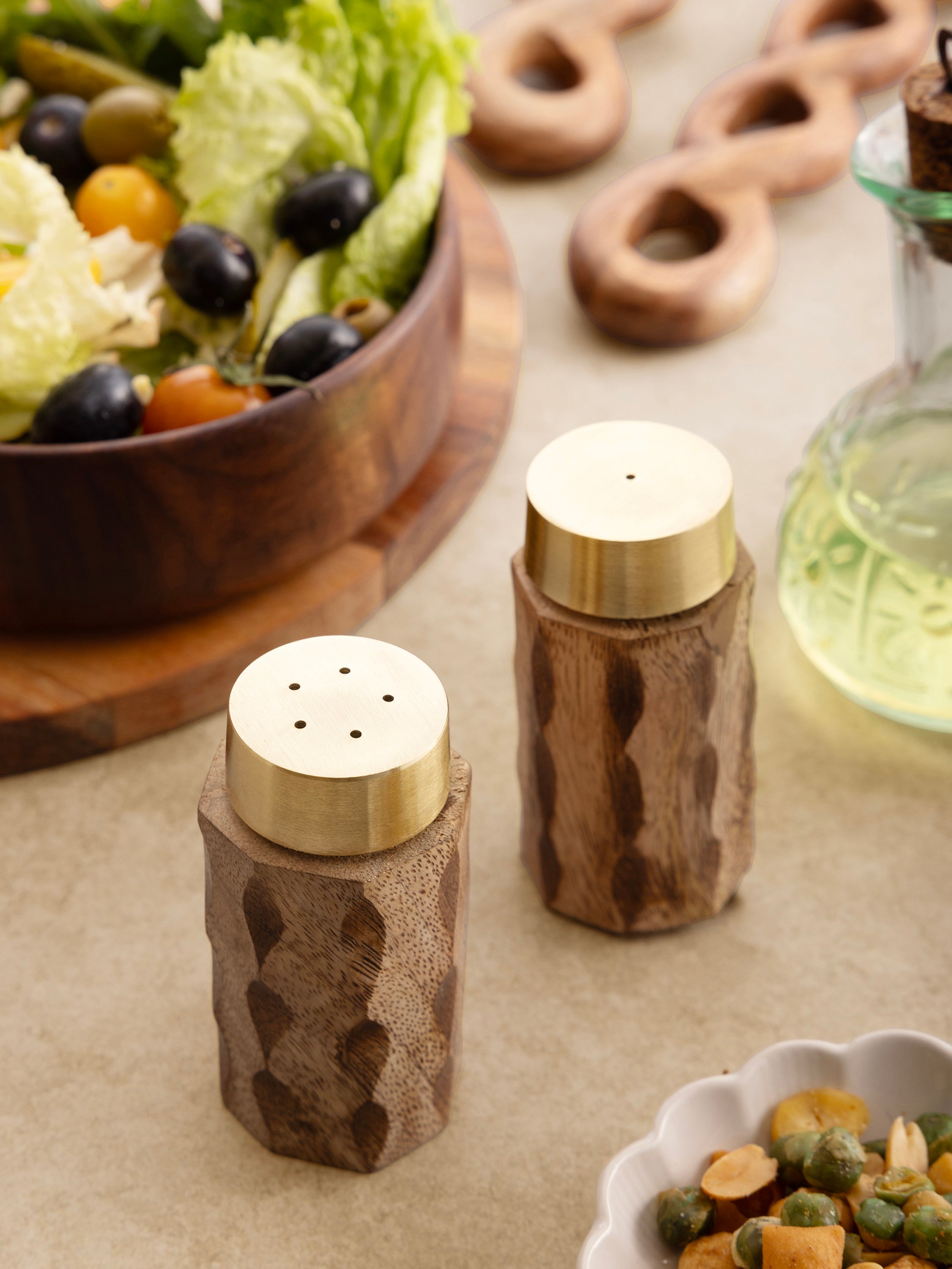 Elegant wooden salt and pepper shakers with a textured design