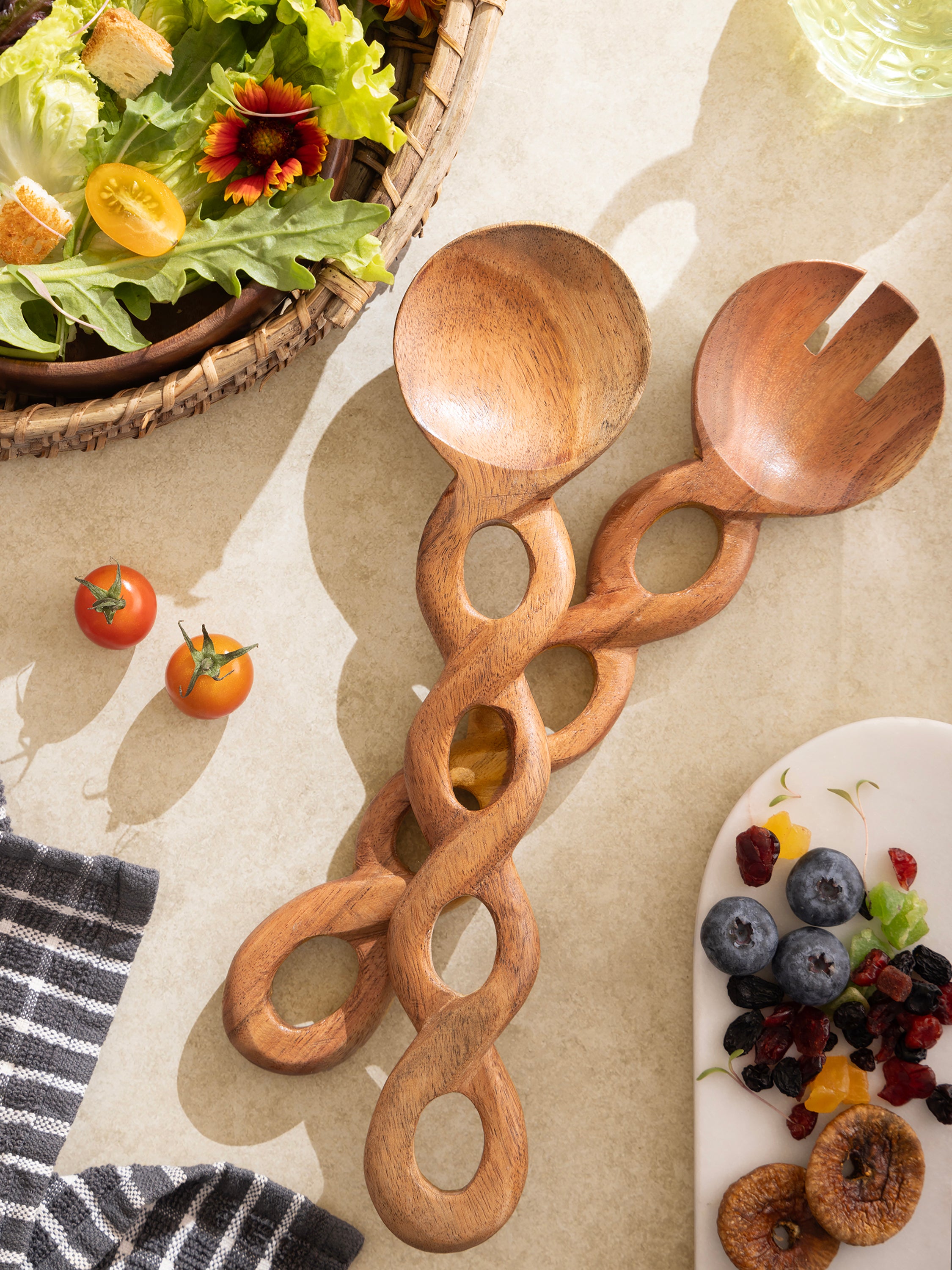 Unique wooden salad spoons with carved looped handles for a stylish table setting