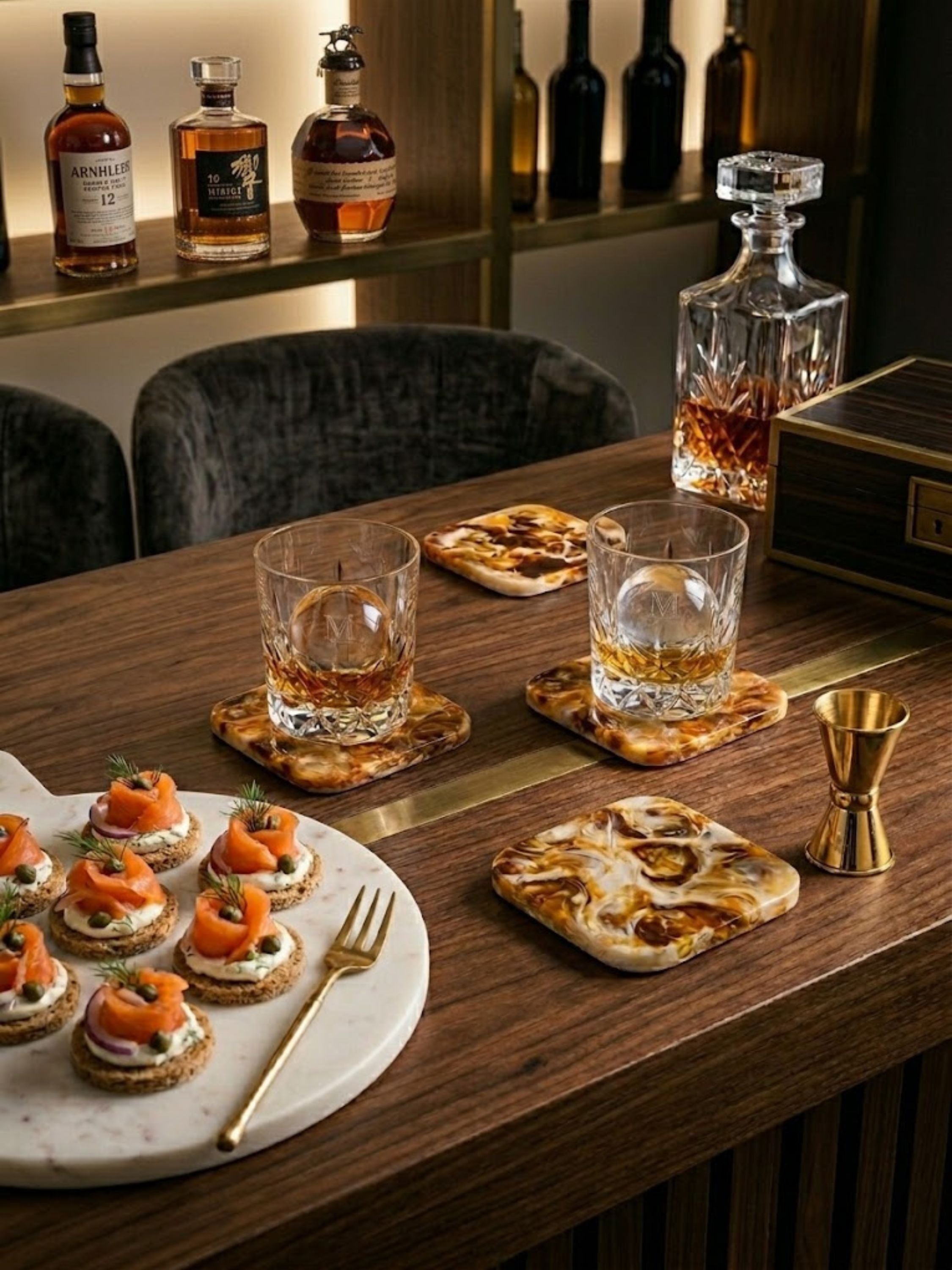 Kampai marbled resin coasters paired with whiskey glasses and barware, highlighting rich swirling resin details for sophisticated cocktail gatherings and home bar styling.