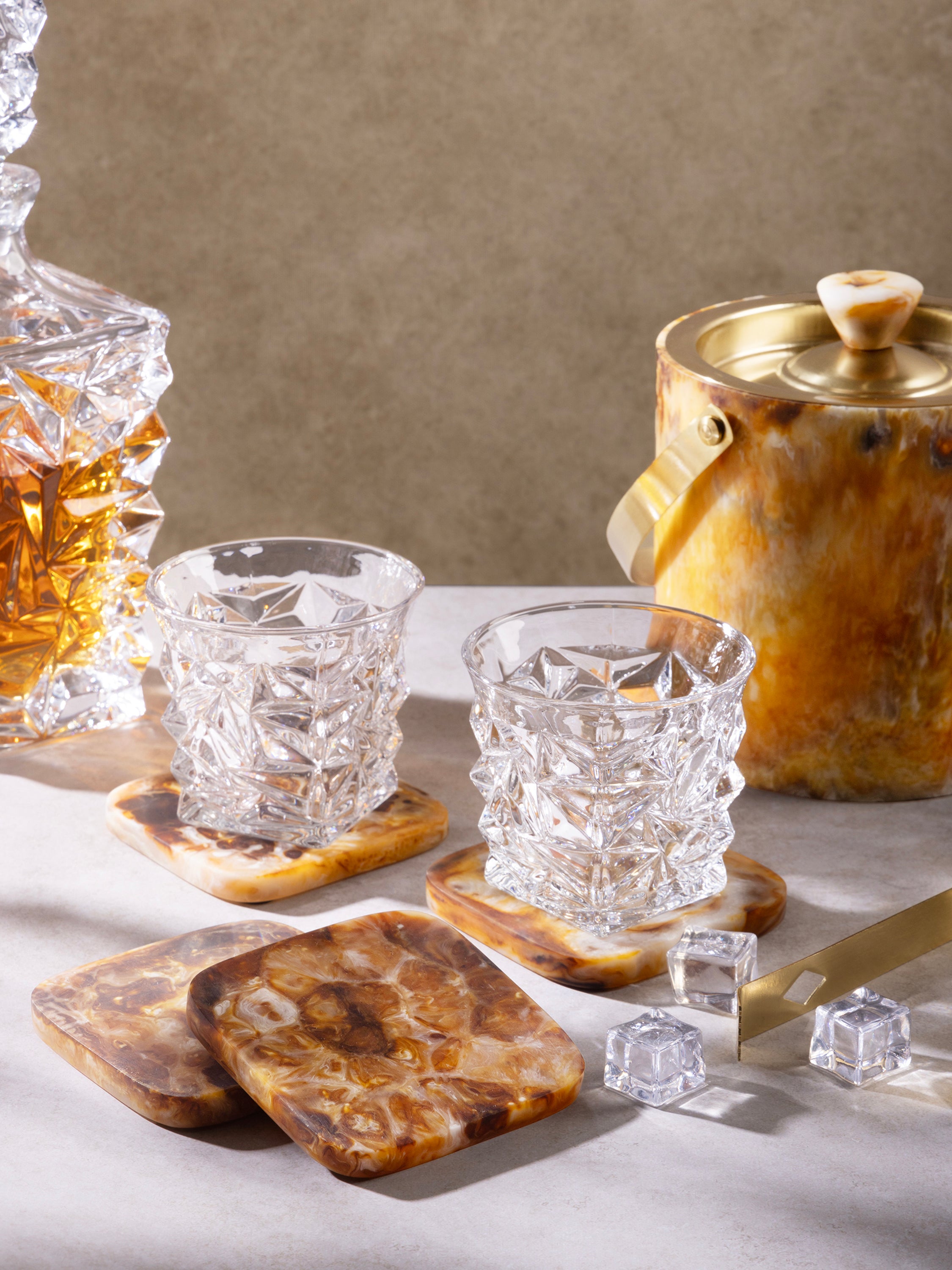 Set of four handcrafted resin coasters in rich brown tones