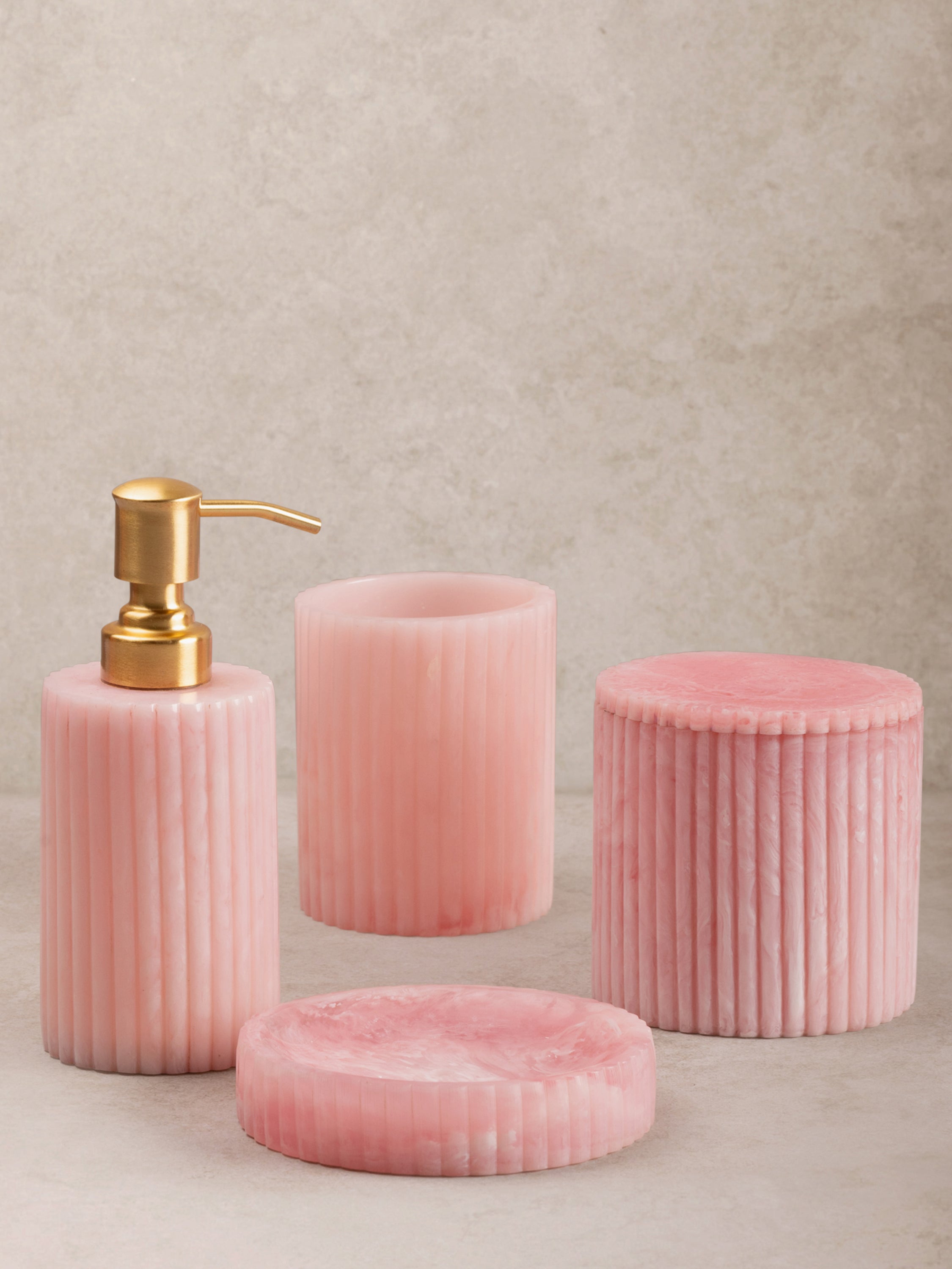 Elegant pink resin bath accessories set with gold soap dispenser