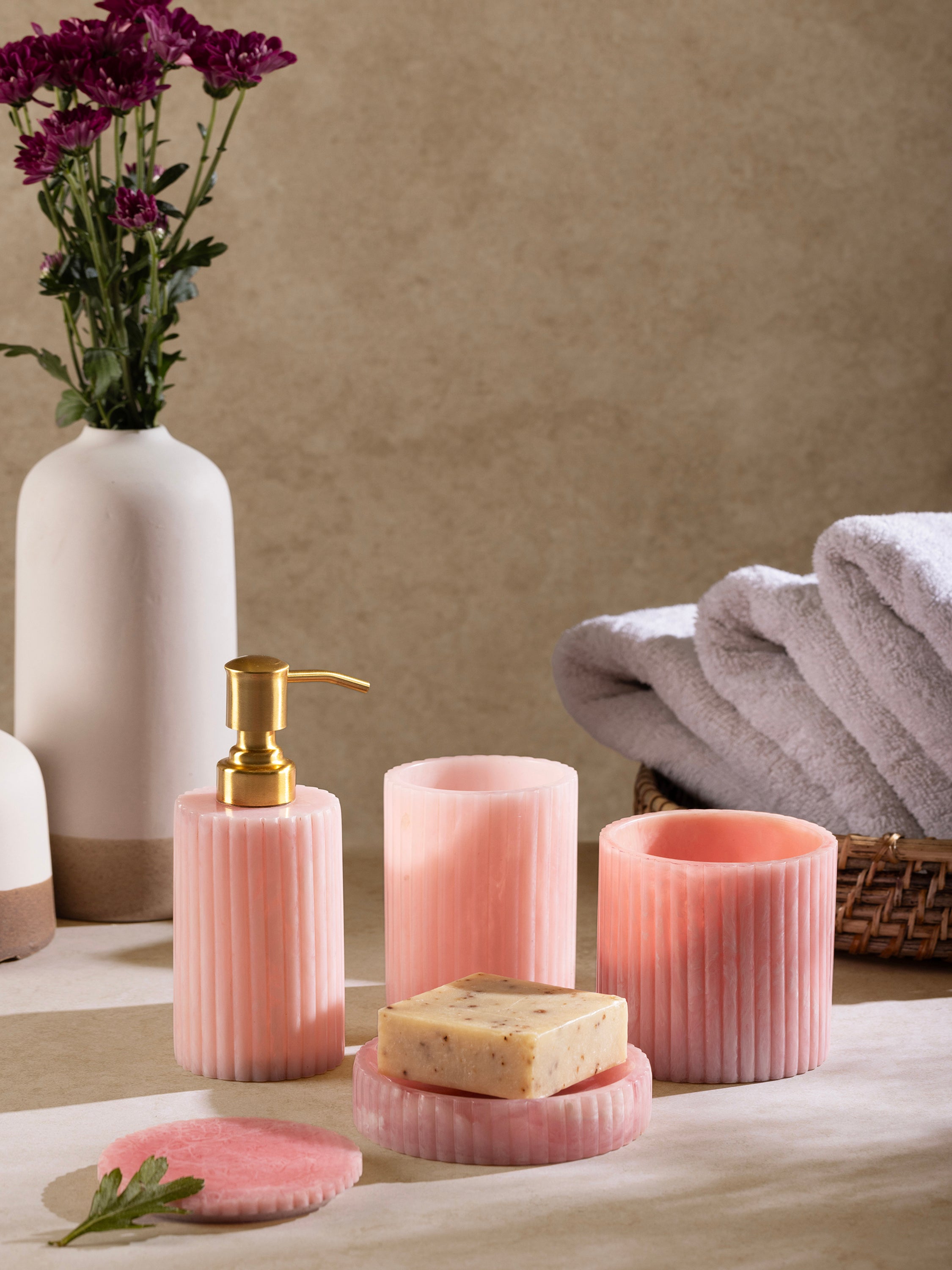 Stylish ribbed resin bath set in pastel pink for a luxurious bathroom touch