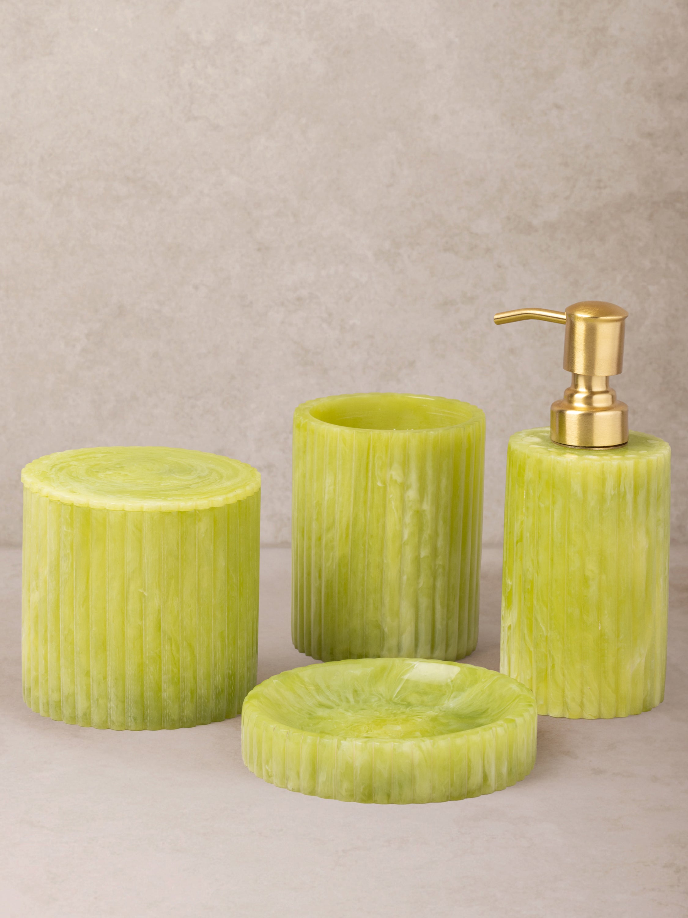 Vibrant green bathroom accessory set made from high-quality resin.