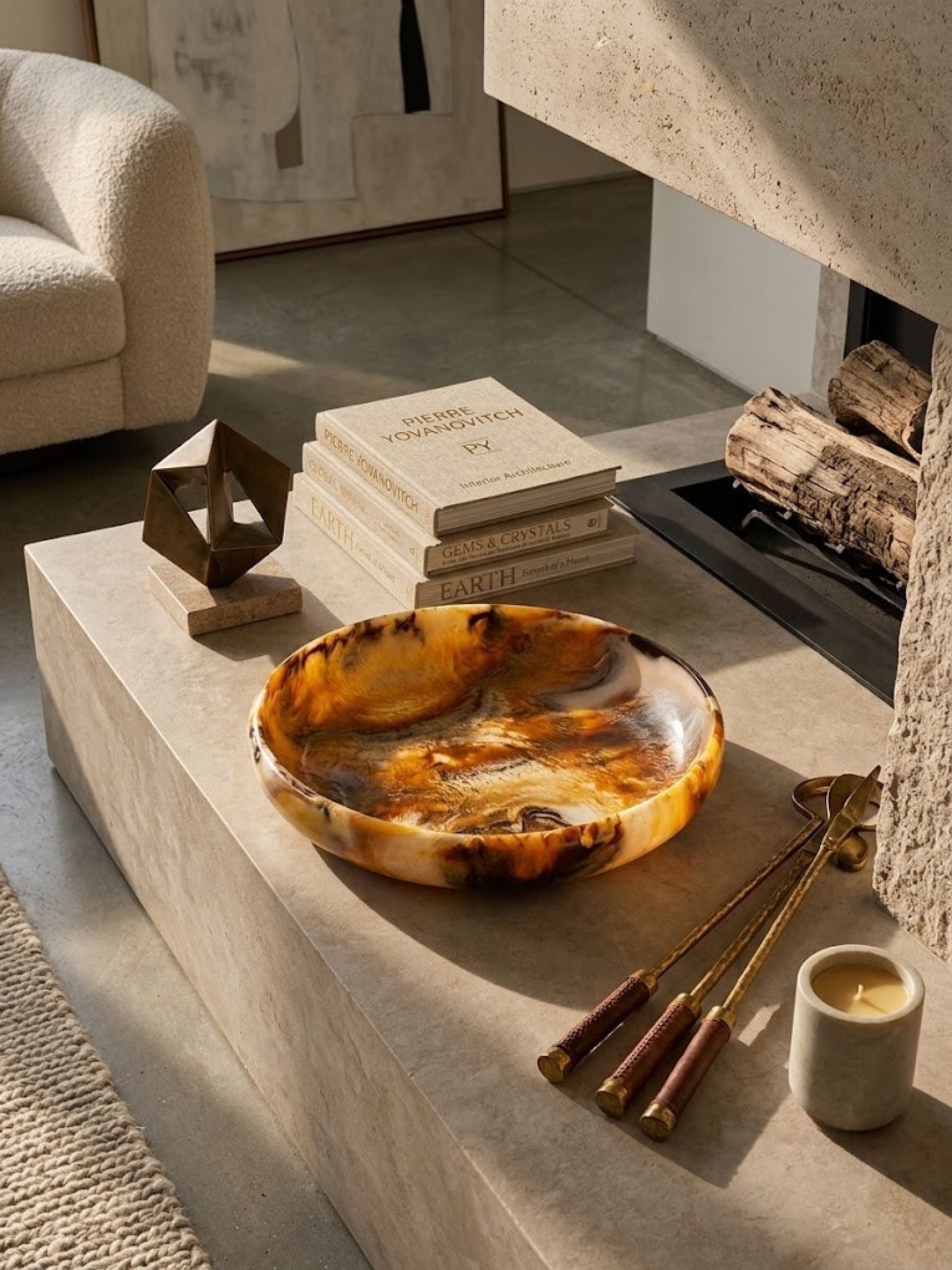 Matte-polished marbled resin bowl, amber and ivory tones moving through a deep brown base.