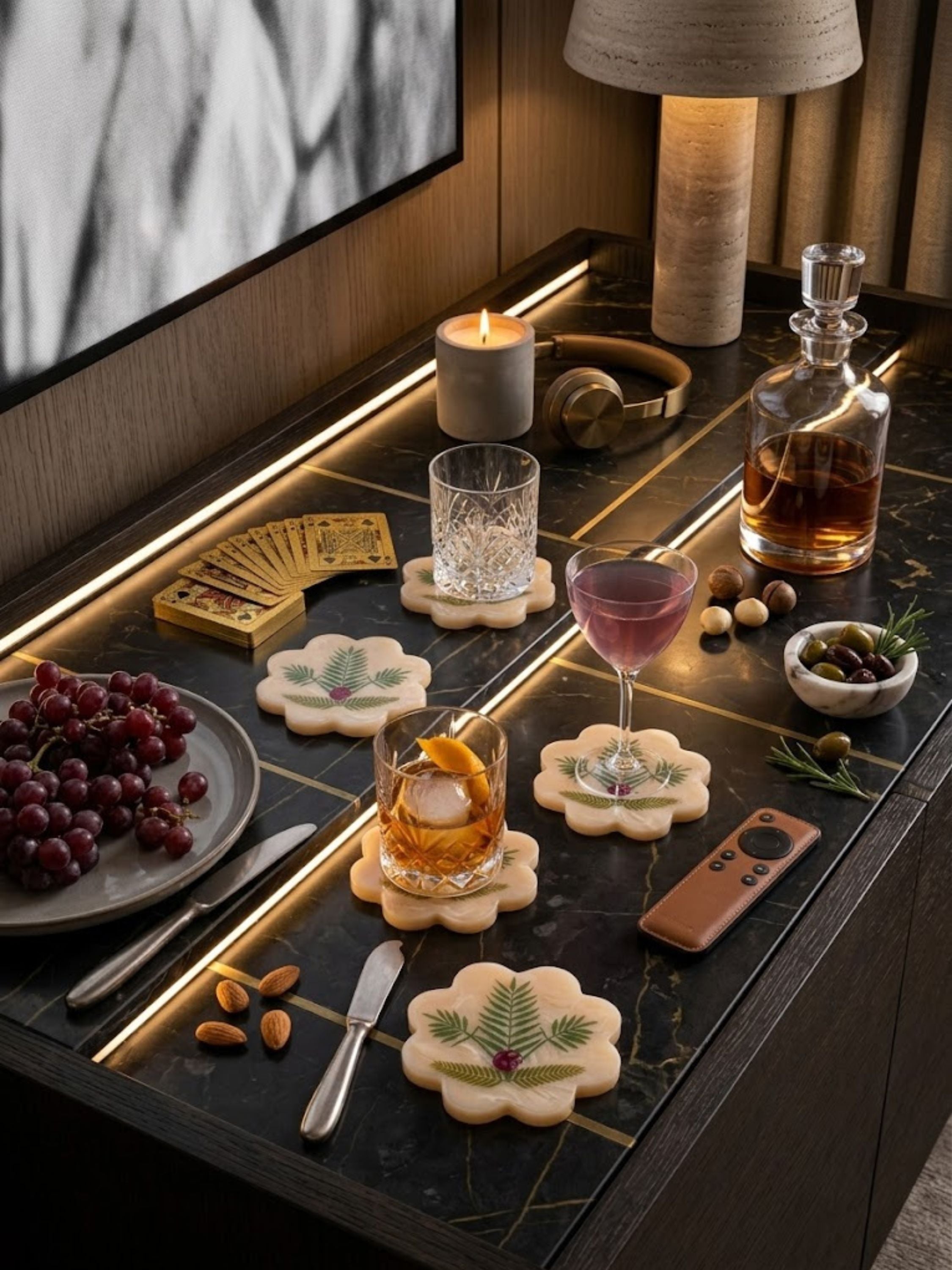 Marbled resin Trellis coasters with scalloped edges, styled at a bar setup with bottles and glasses.