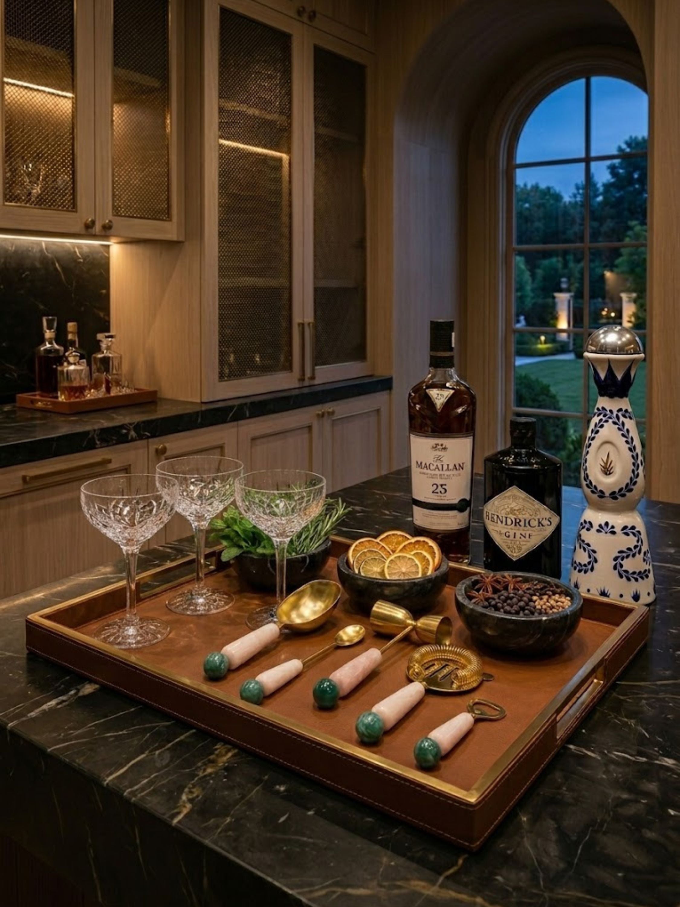 Copenhagen resin bar tools styled on a luxury serving tray with crystal stemware and cocktail ingredients, bringing polished sophistication to home entertaining.
