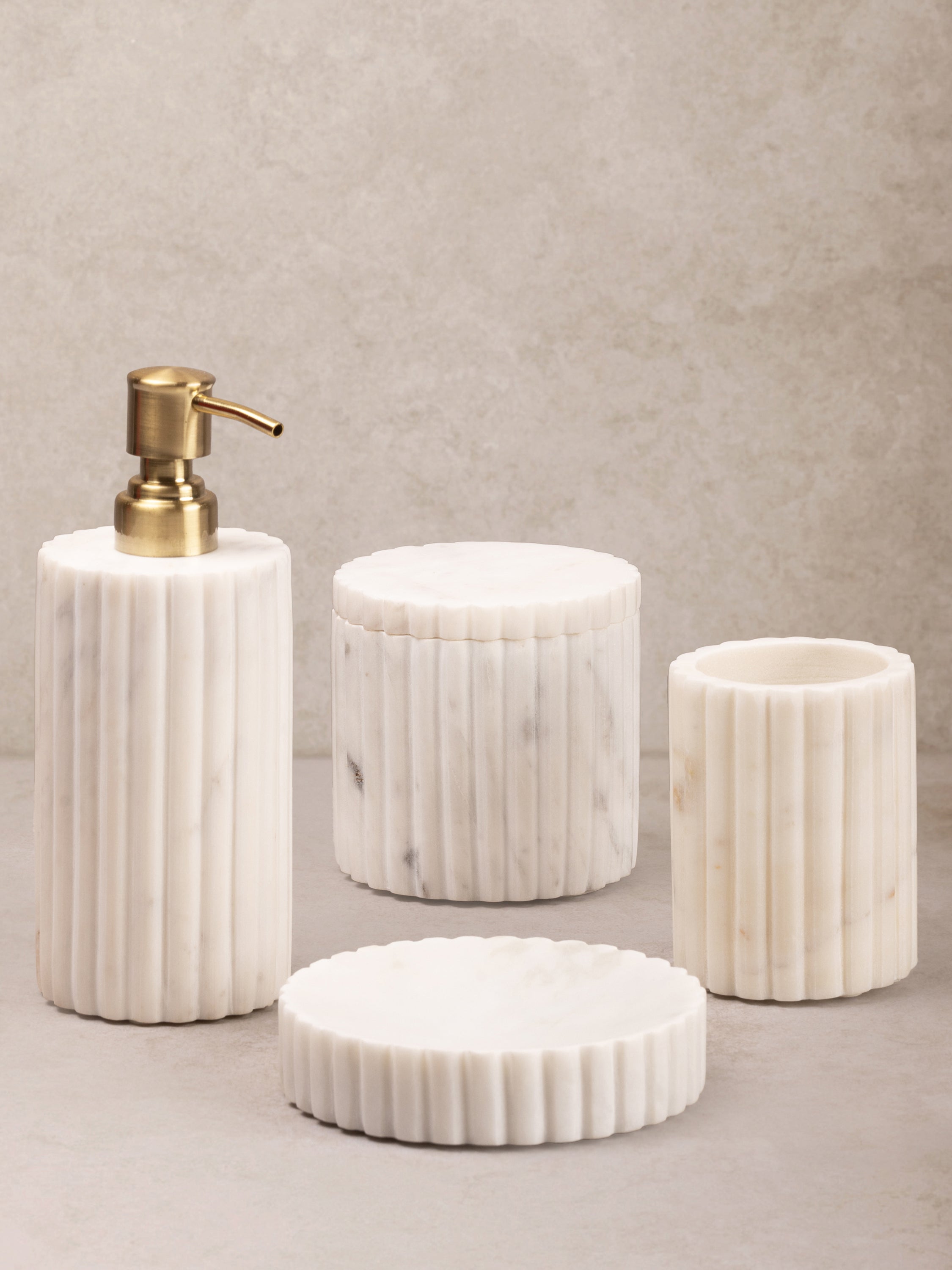 Luxury White Marble Bathroom Accessories Set – 4-Piece Collection
A premium handcrafted bathroom accessories set made from natural white marble with a fluted design, including a soap dispenser, tumbler, jar, and tray for an elegant touch