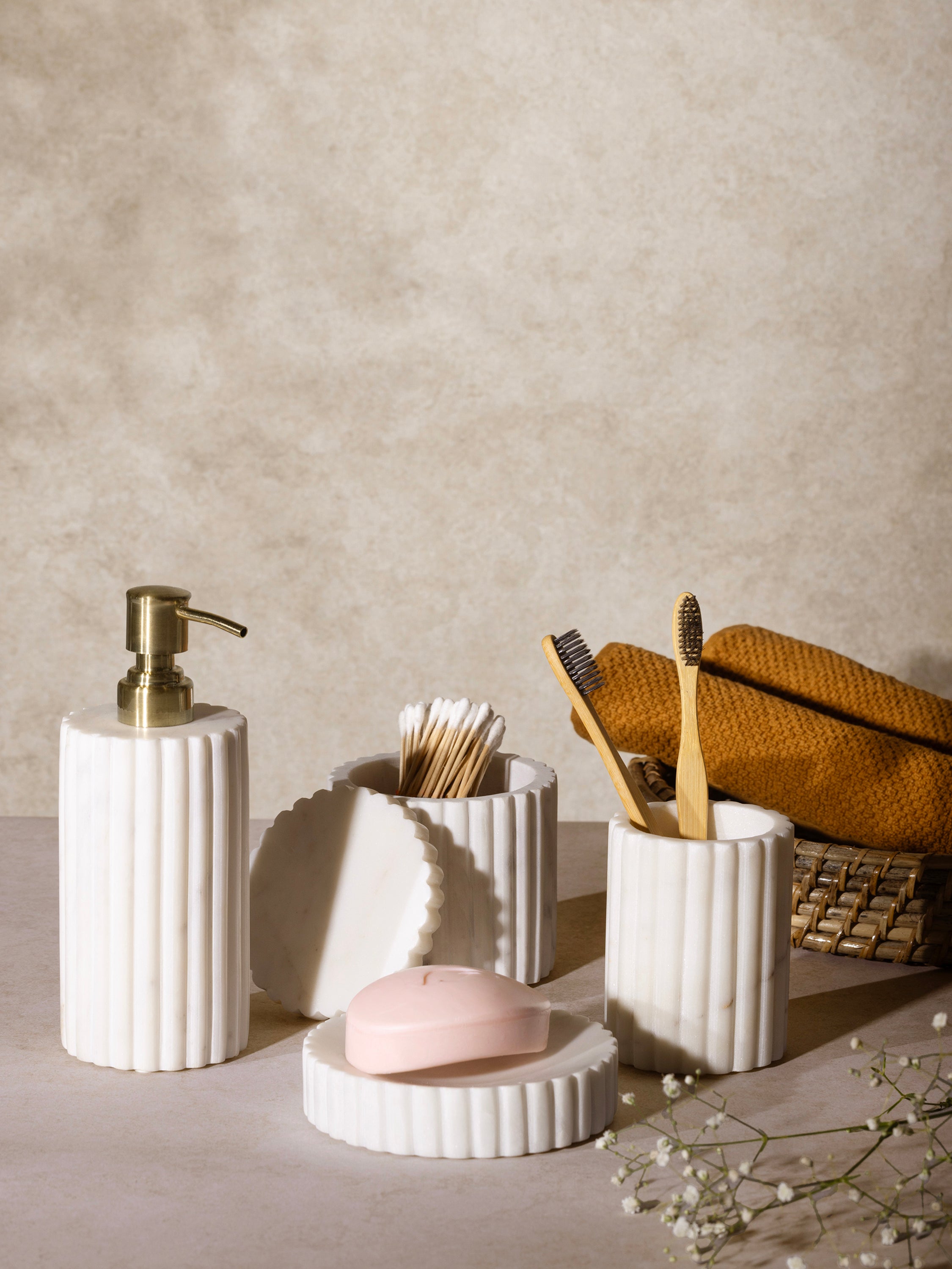 Handmade White Marble Bath Set – Elegant Bathroom Décor
A sophisticated 4-piece bathroom set featuring a marble soap dispenser with a gold pump, a tumbler, a storage jar, and a soap dish, perfect for modern and luxury bathrooms