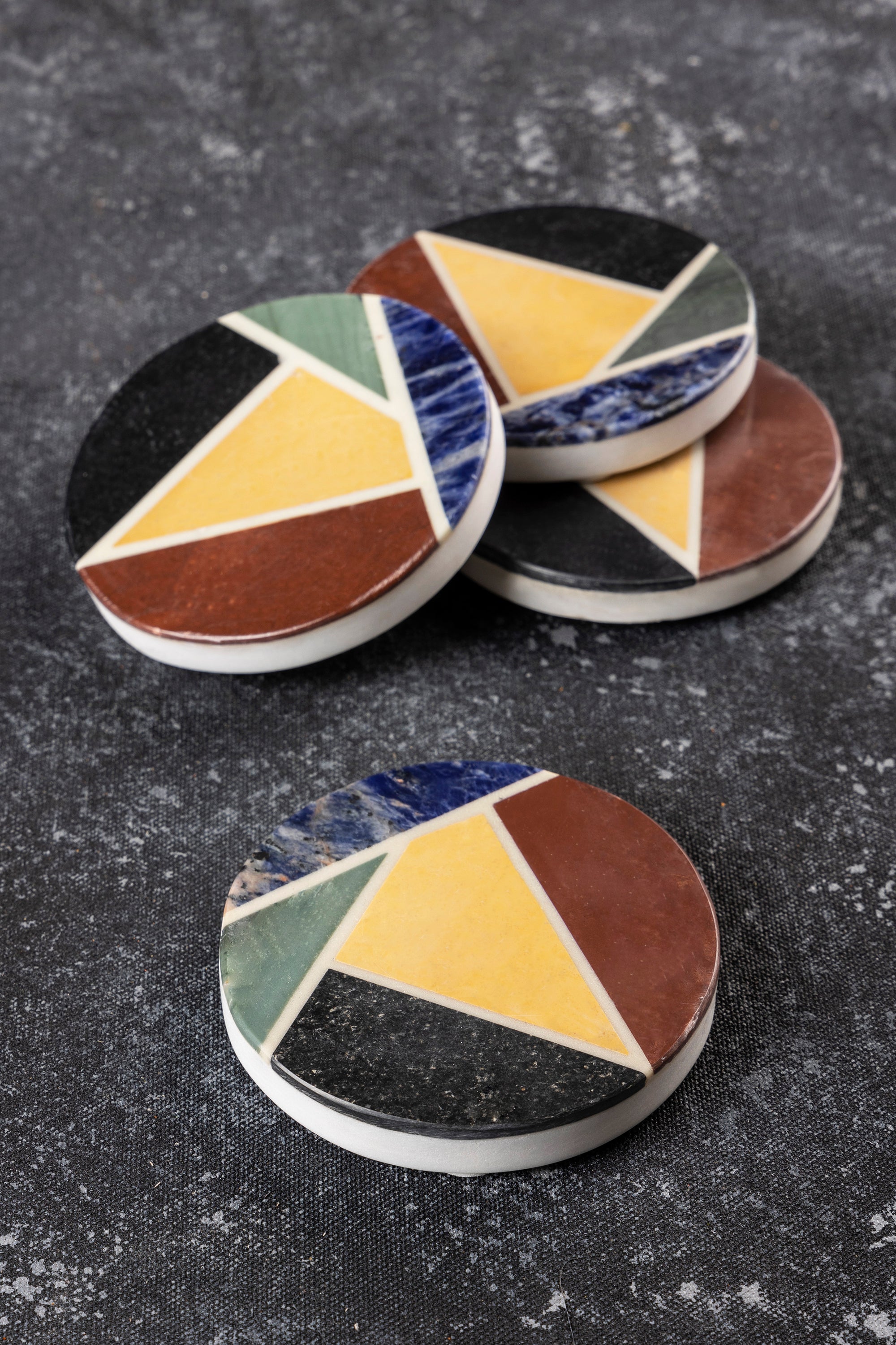 Handcrafted marble coasters with multicolor geometric inlay — artisan luxury tabletop accent