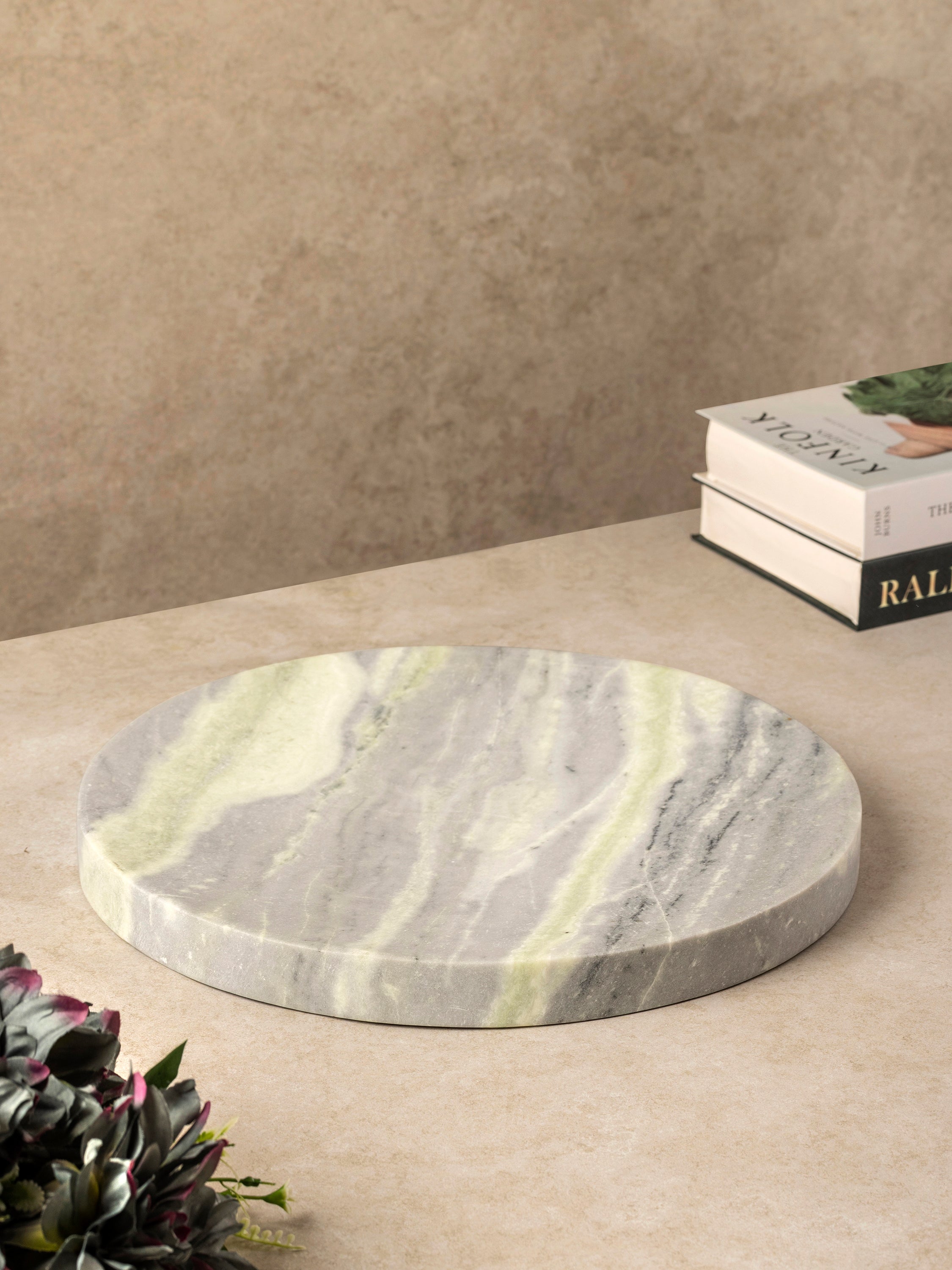 Round onyx tray in gray and green tones with soft banded veining, shown in a clean top-down composition