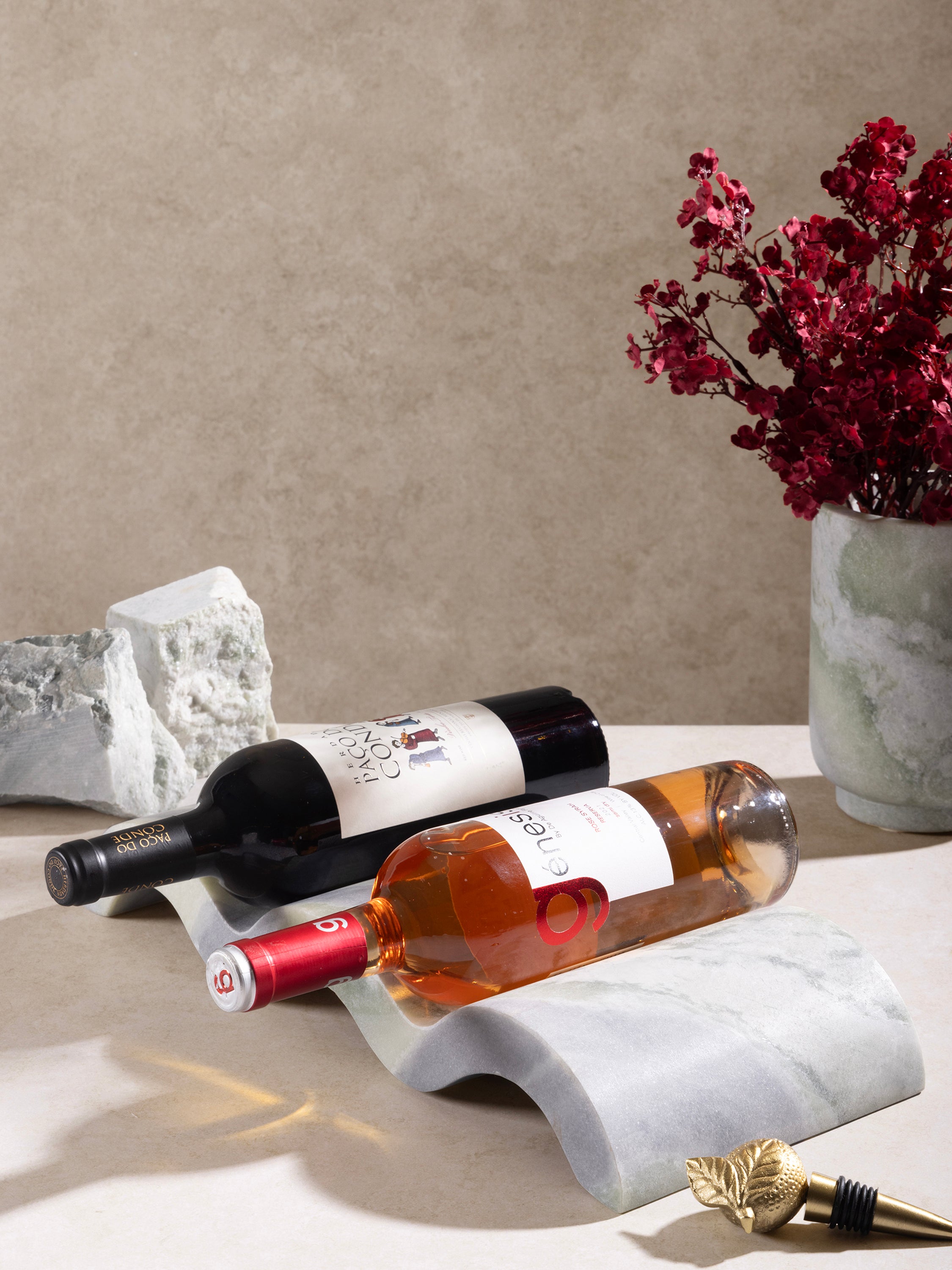 Wine bottle placed in Georgia onyx holder on bar countertop