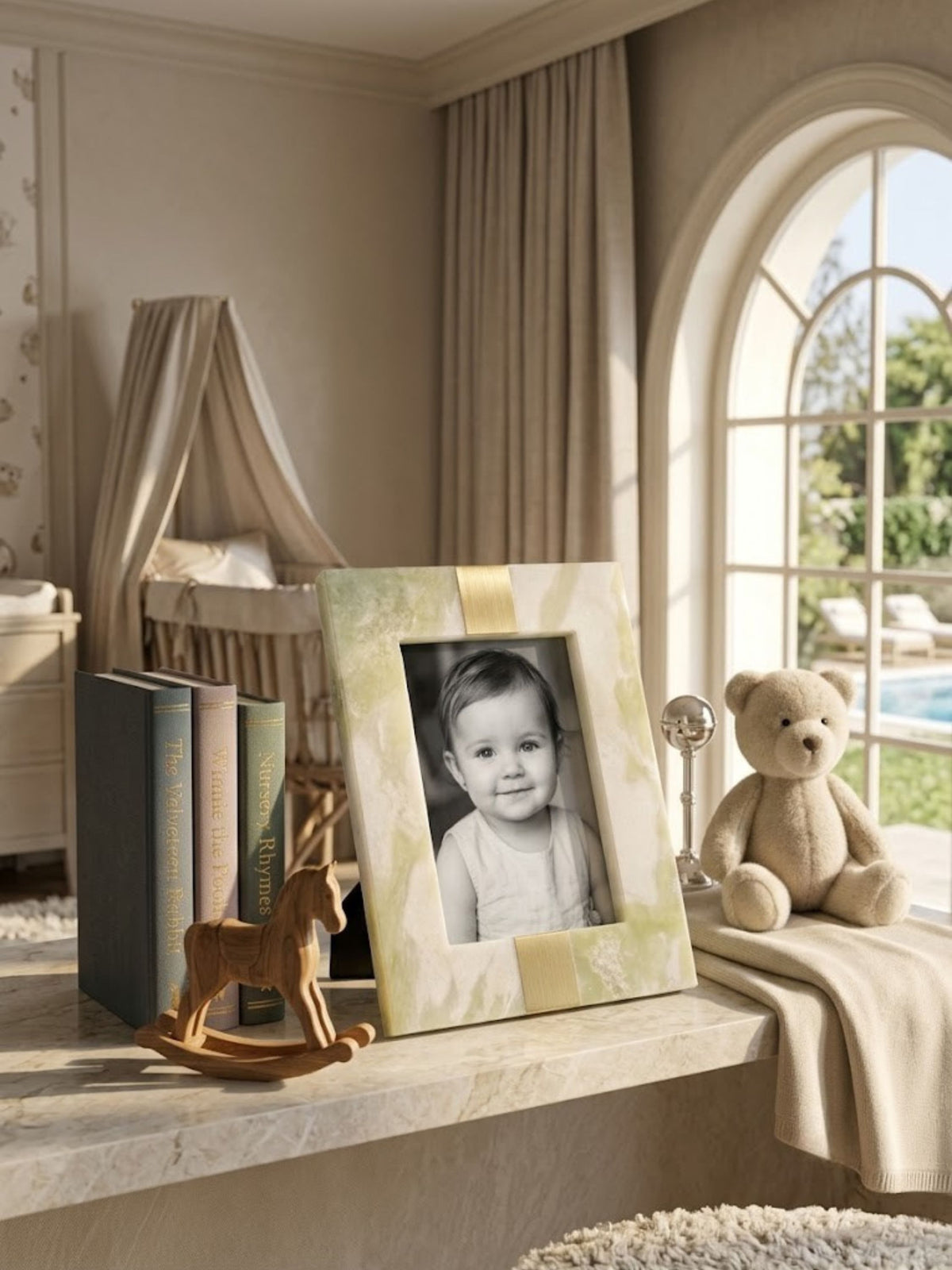 Green onyx picture frame with a brass tab detail, styled on a shelf.