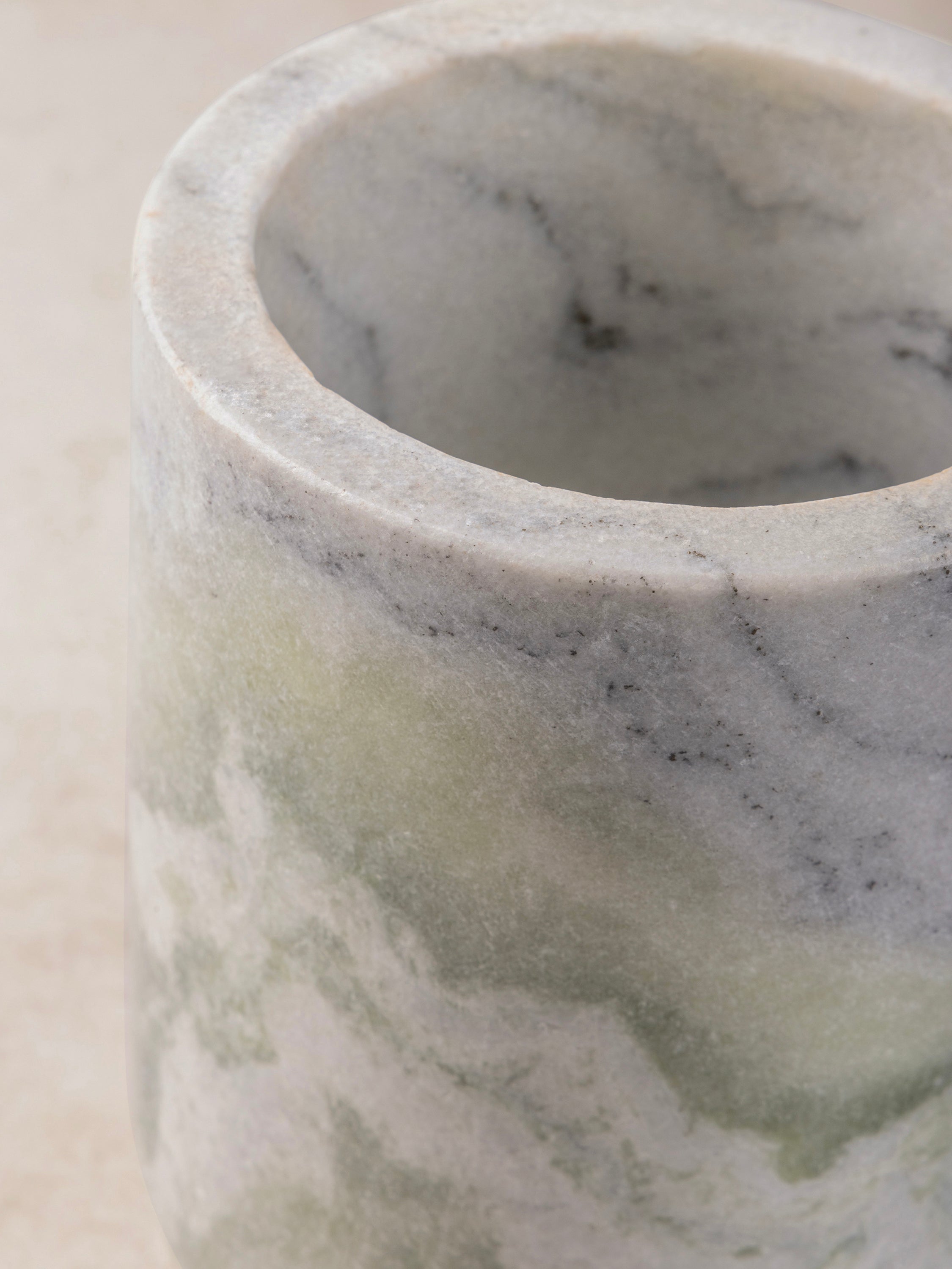 Close-up of the Chamonix green onyx cooler, showing its natural veining and subtle light passing through the polished stone.