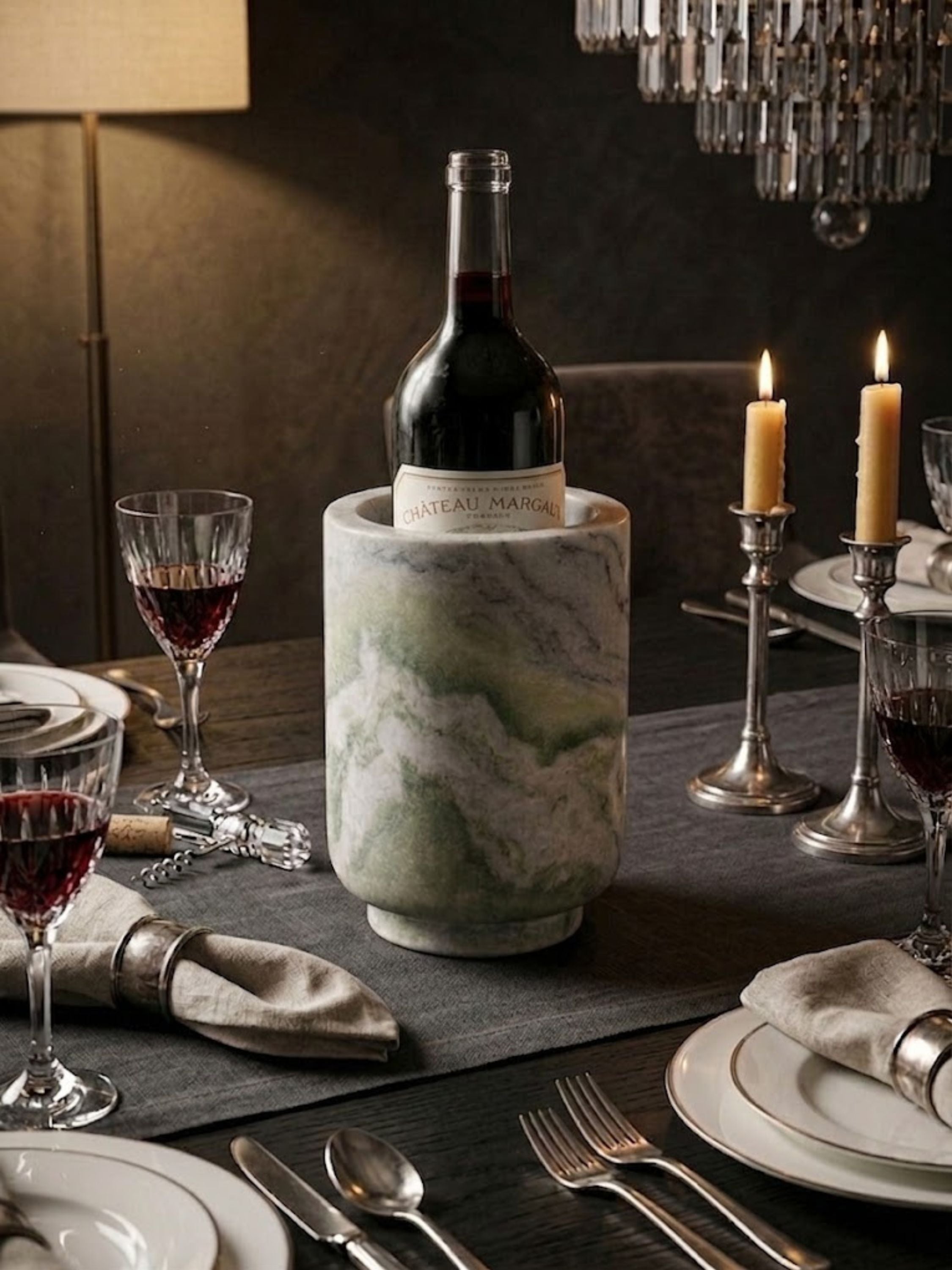 Chamonix green onyx wine cooler presented in a formal dining setting with crystal glassware and layered linens.