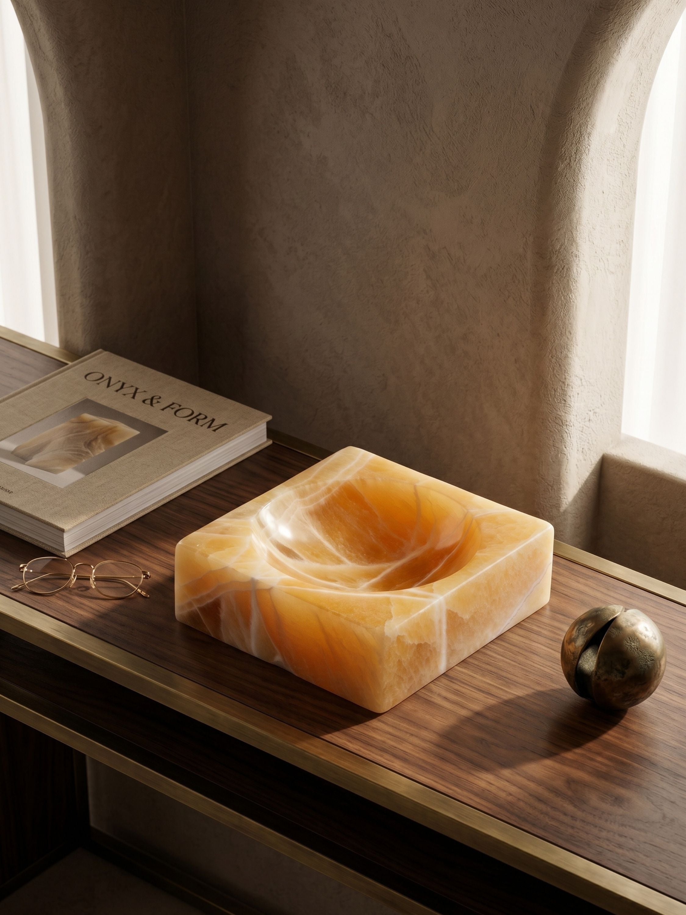 Marigold onyx catchall bowl with flowing natural veining, presented as a decorative stone object for consoles, shelves, and tabletop arrangements.