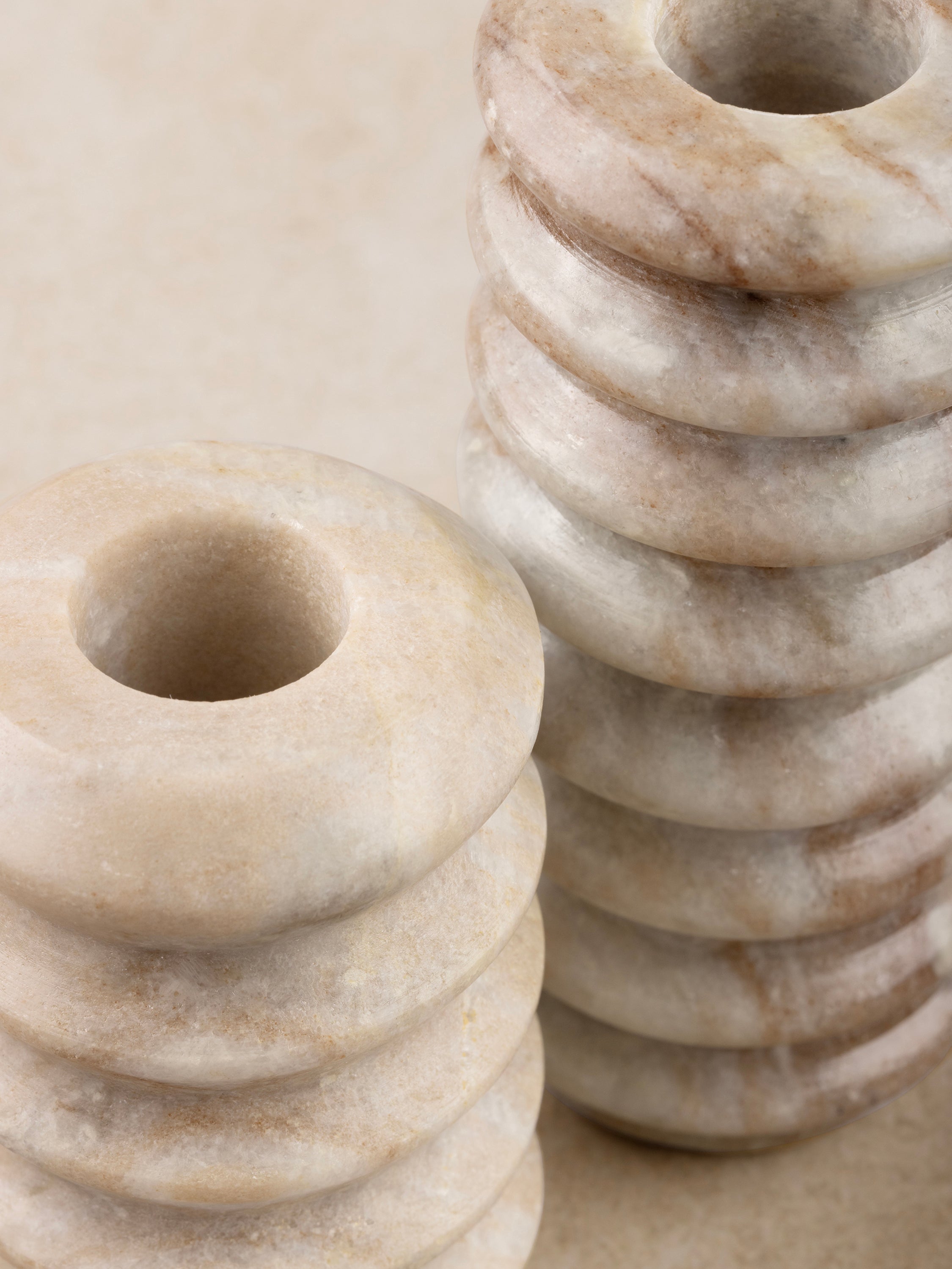 Close-up of scalloped detailing and natural veining on marble holder