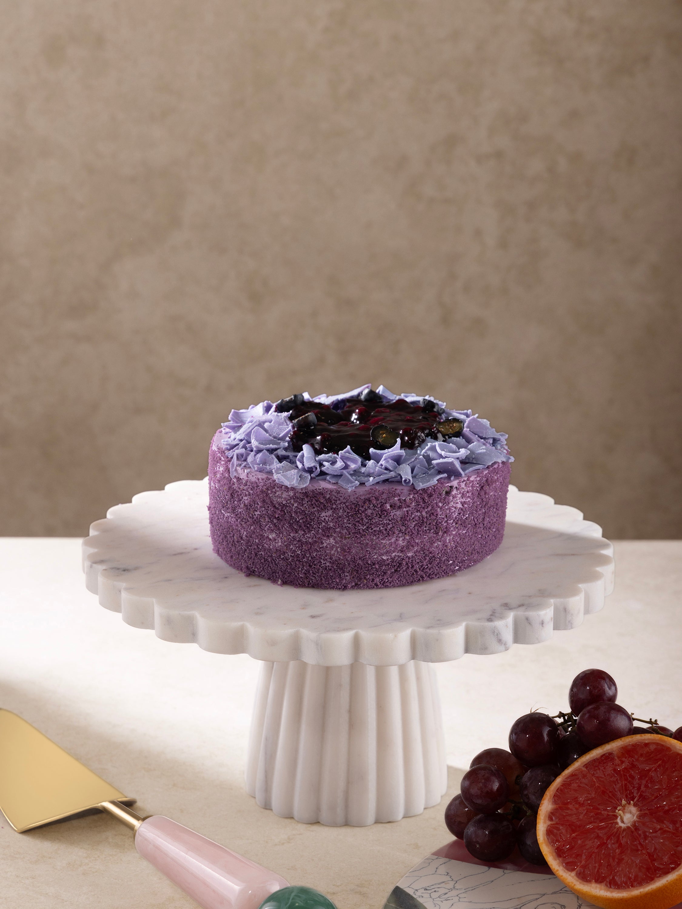 Cake stand styled with a decorated dessert on top