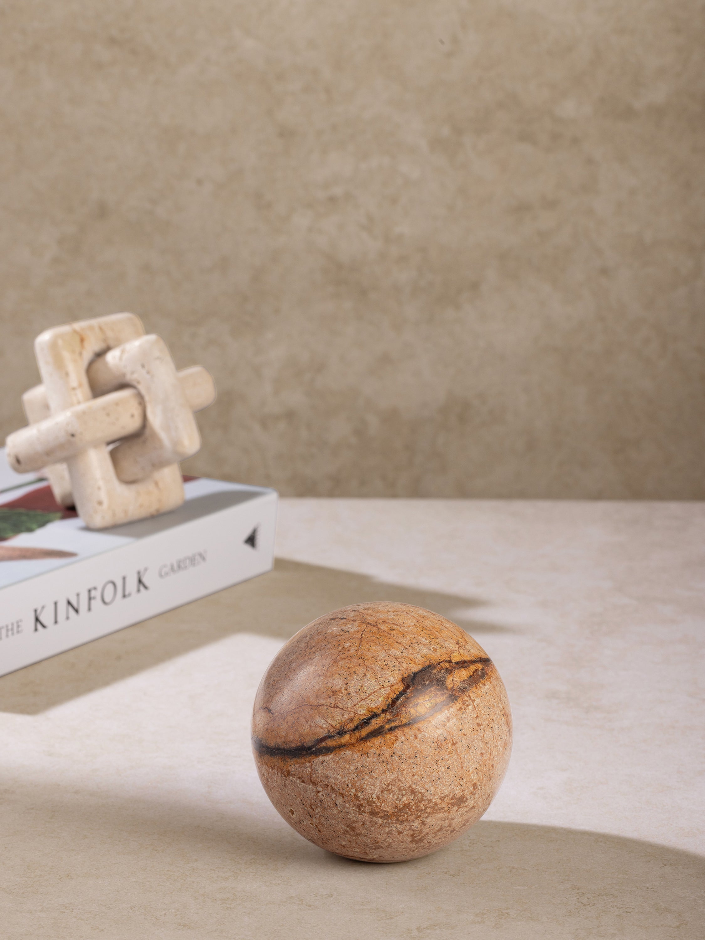 Forest onyx marble sphere styled on shelf or coffee table accent