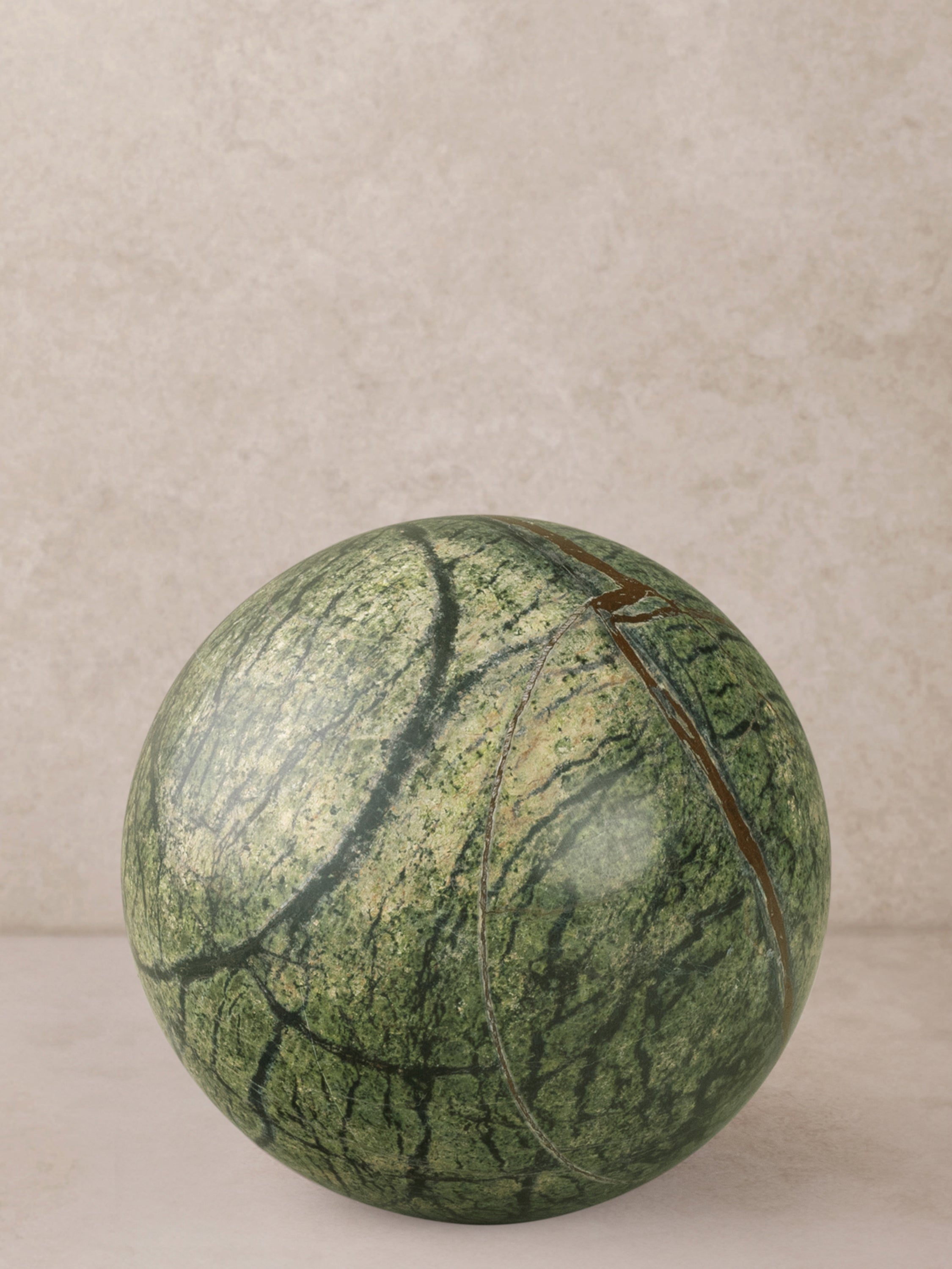 Forest onyx marble decorative sphere in moss green.