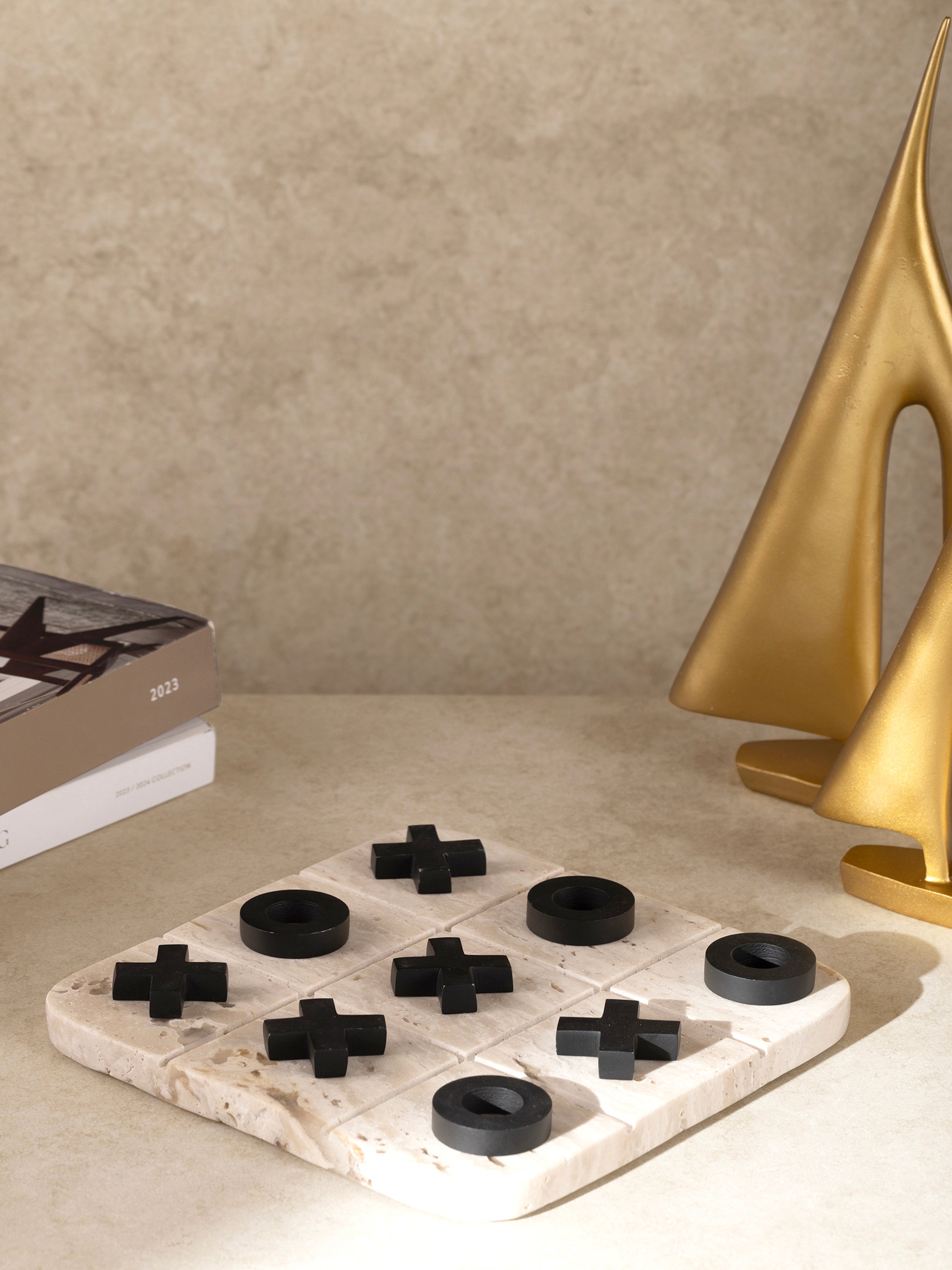 Tic tac toe set styled on coffee table as décor accent