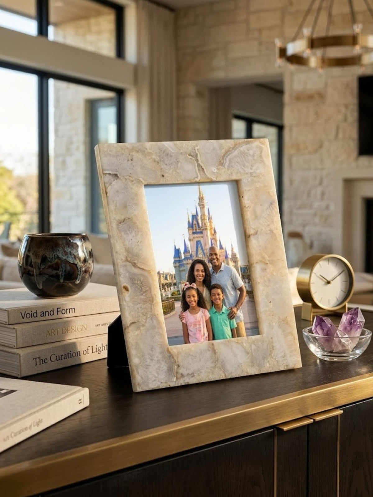 Agate stone picture frame with banded veining, holding a family portrait.