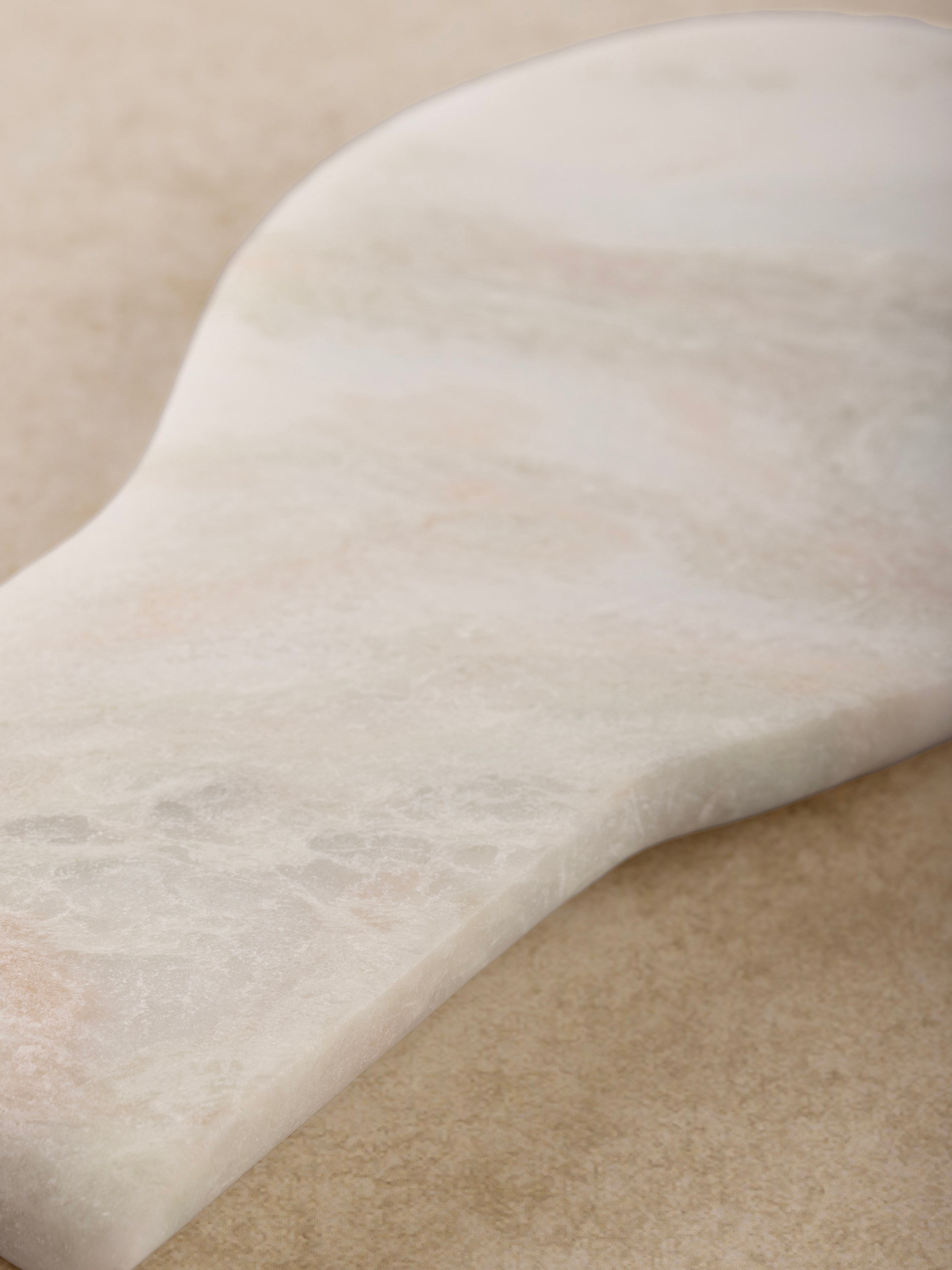 Close-up of polished multicolor onyx veining on spoon rest