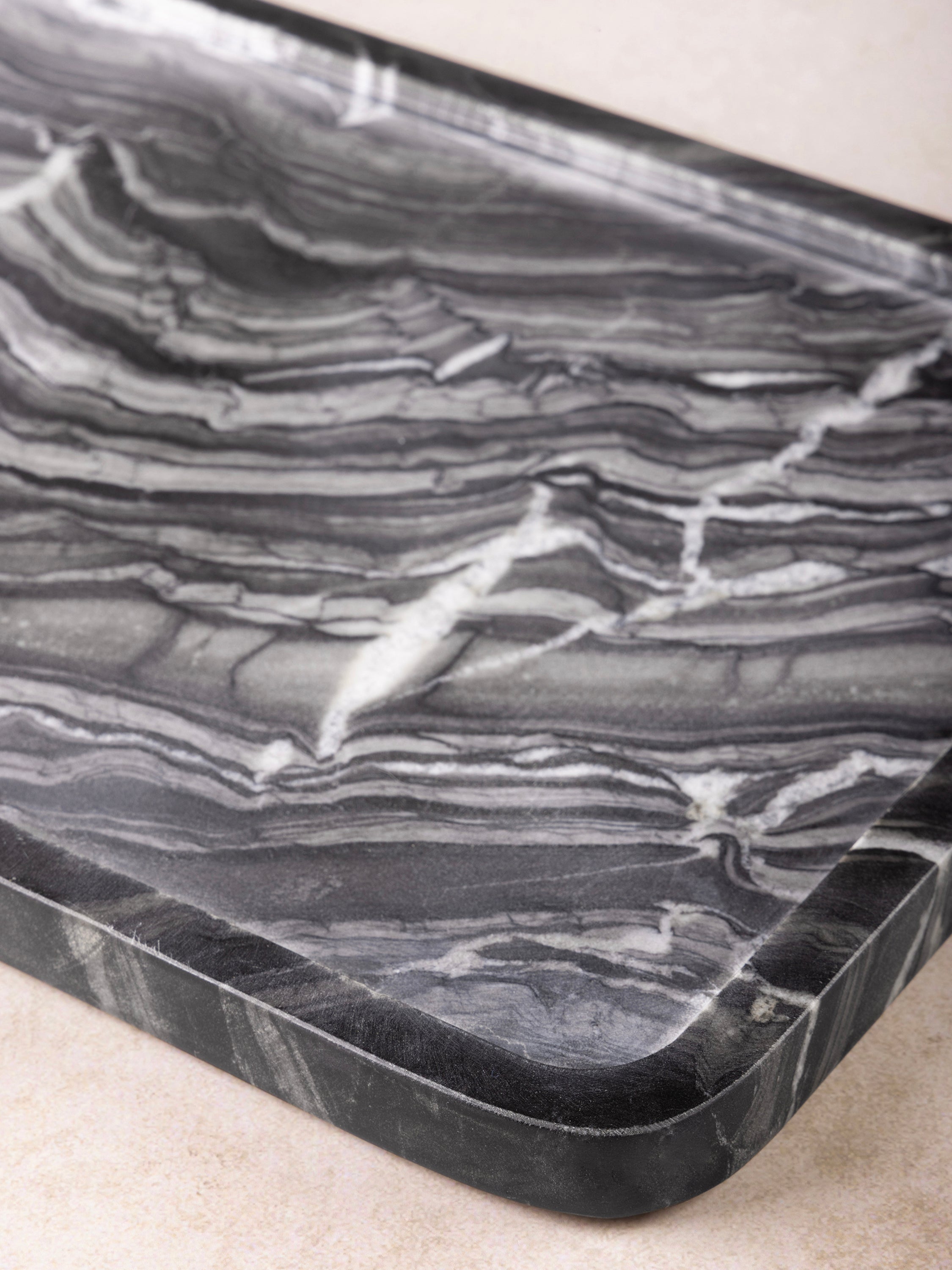 Edge detail showing marble grain and scalloped contour of Frontier Tray