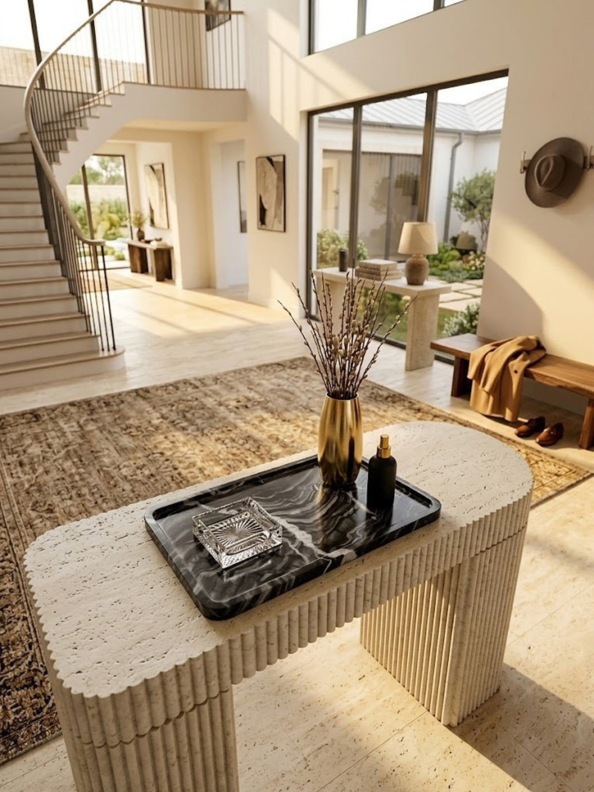 Frontier black onyx tray with polished veining, holding a diffuser on an entryway console.