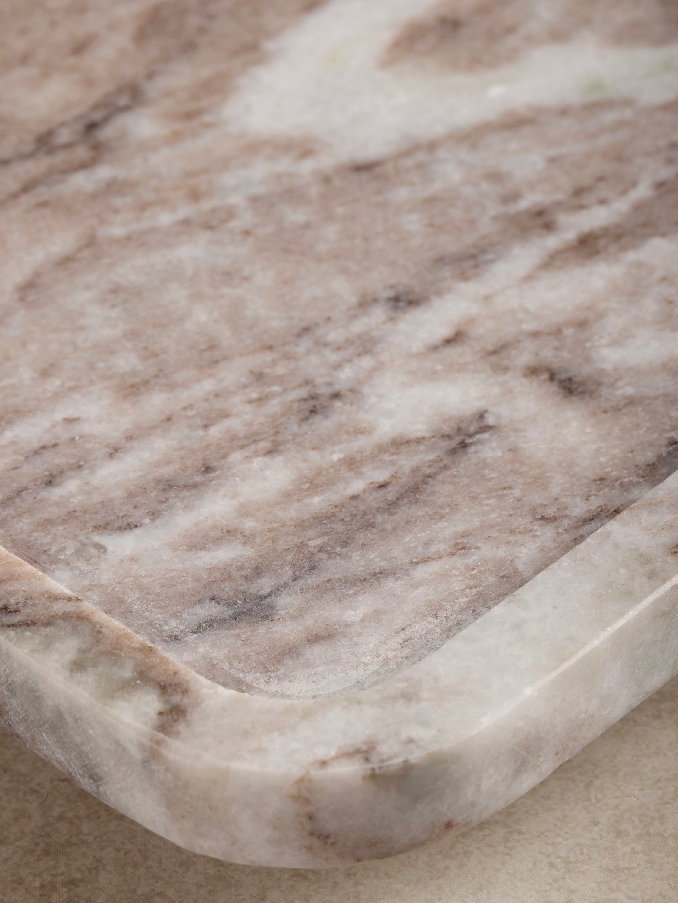 Versatile beige marble tray with soft tones, adding luxury to any living space