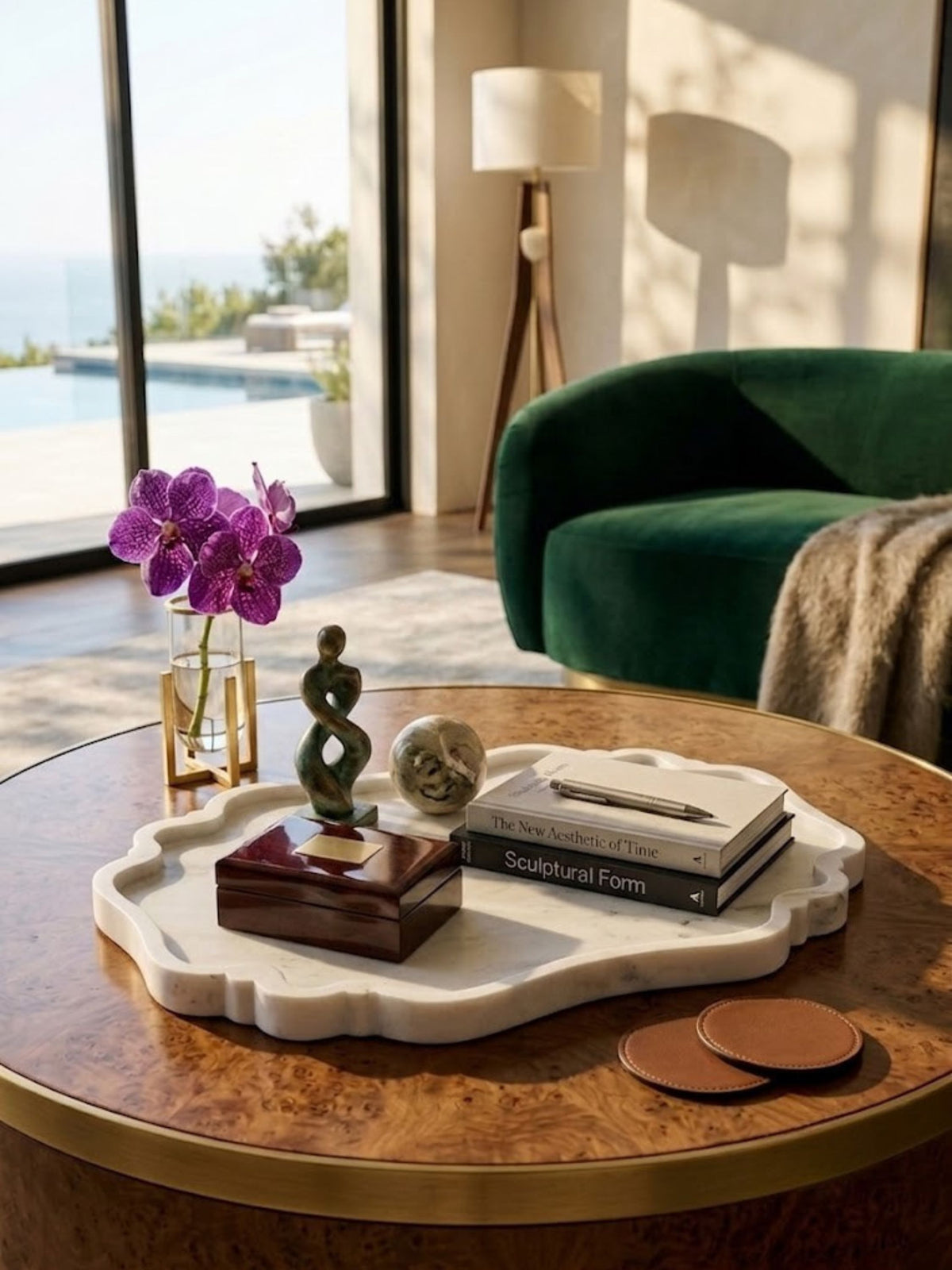 White marble tray with a routed rim, styled on an outdoor coffee table.