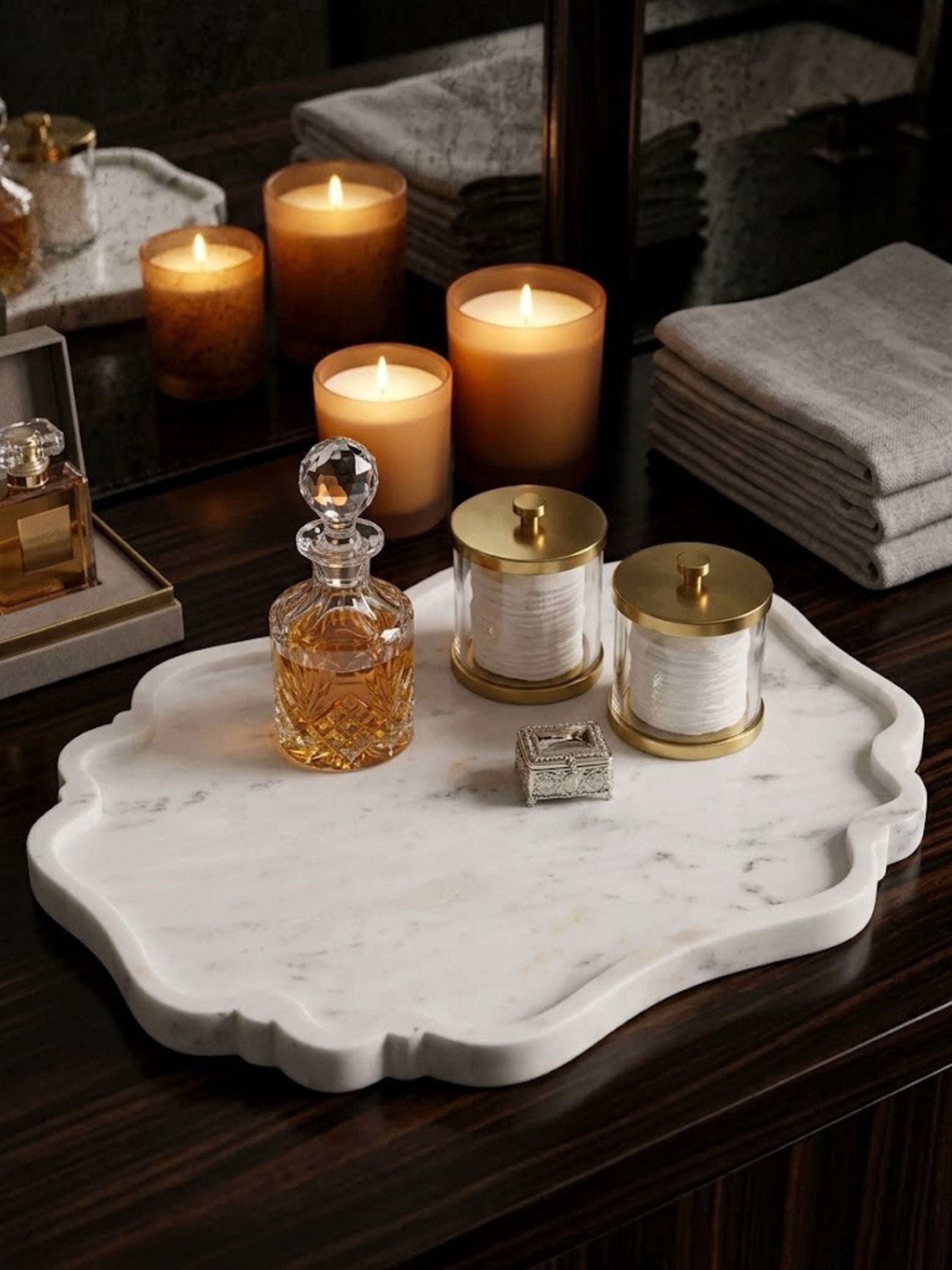 White marble tray with fine grey veining, styled on a bedroom dresser with candles.