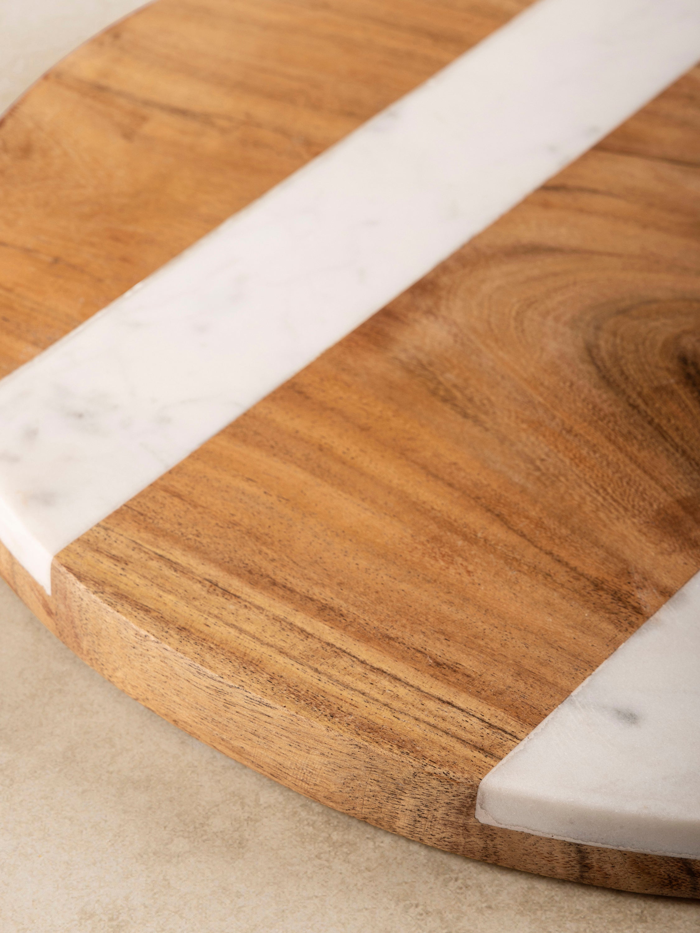 Sleek wood and marble charcuterie board to elevate your table setting