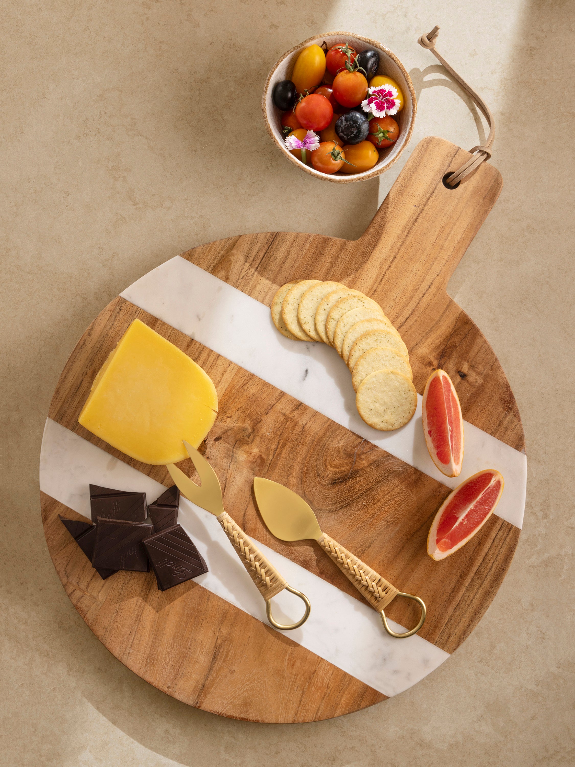 Board styled with charcuterie and appetizers in elegant setting