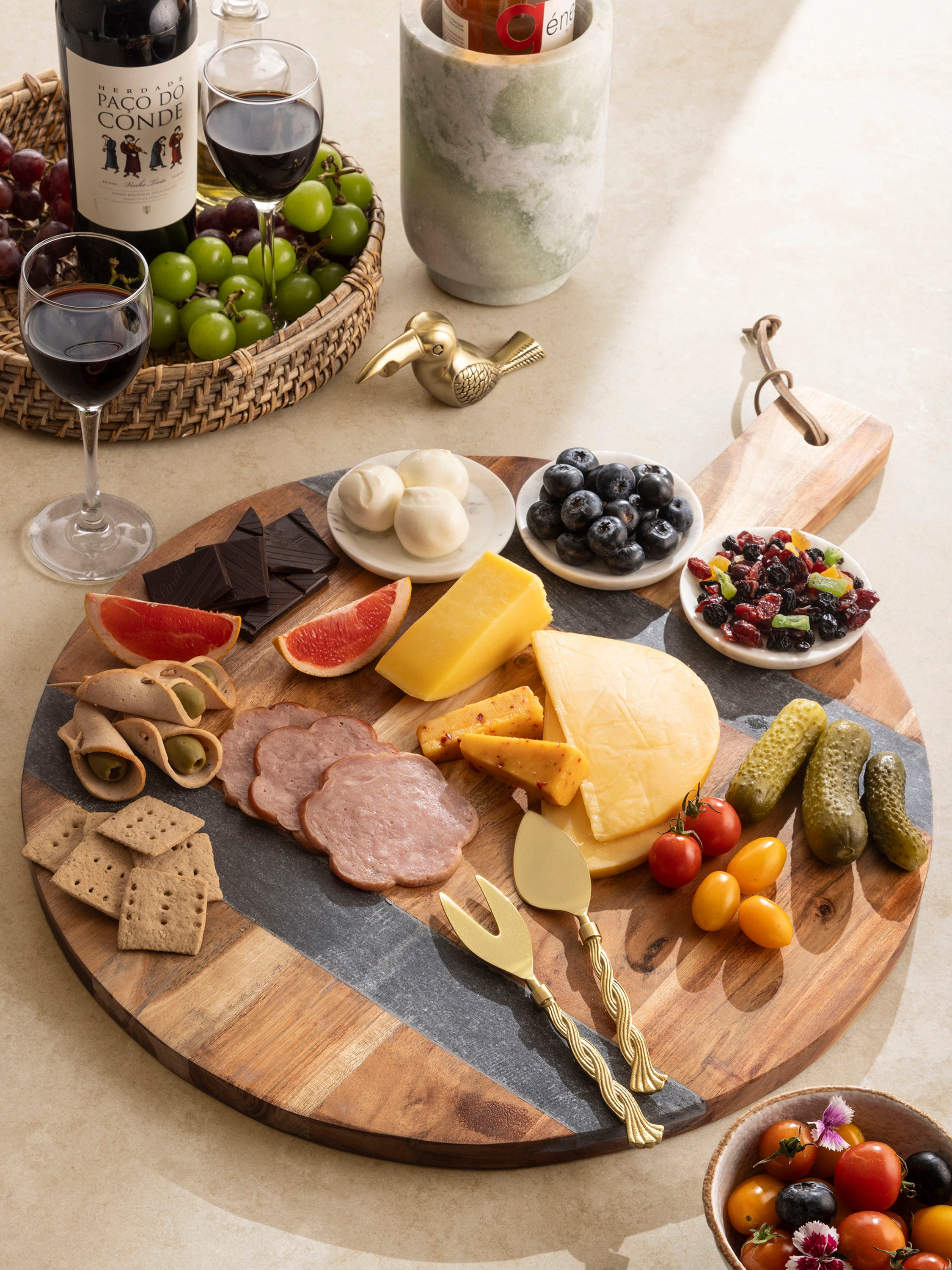 Durable wood and marble charcuterie board for a unique serving display