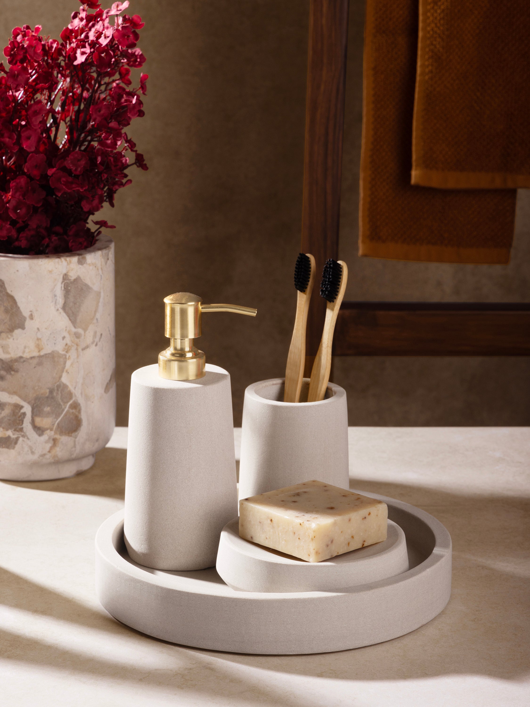 Bath vanity styled with Casablanca accessories and neutral décor