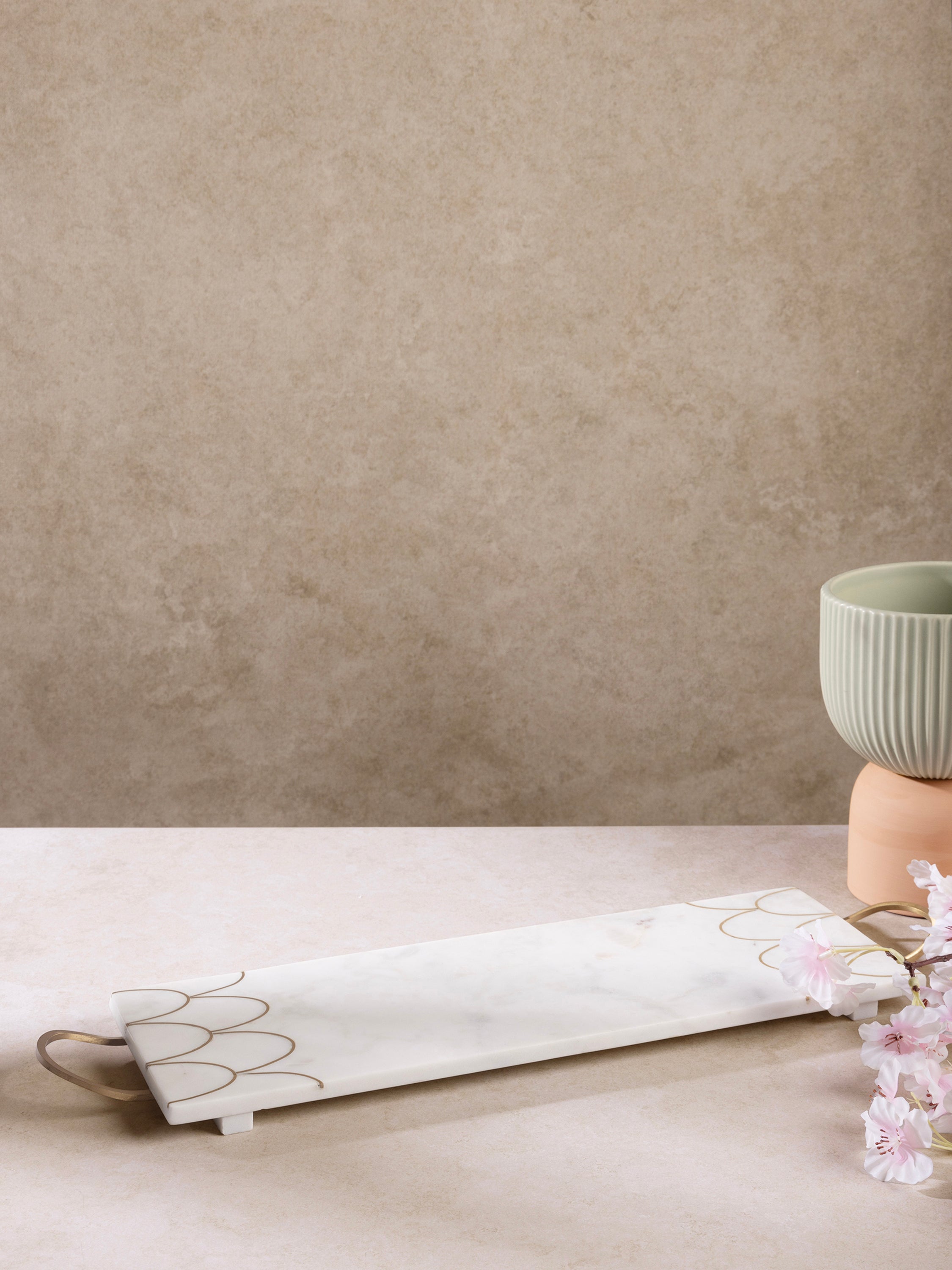 Marble tray styled with candles and decor on console table
