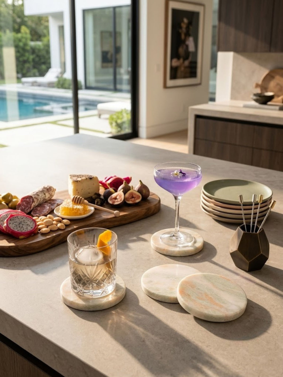 Onyx coaster set of four styled on a kitchen counter, peach and blush tones in the stone.