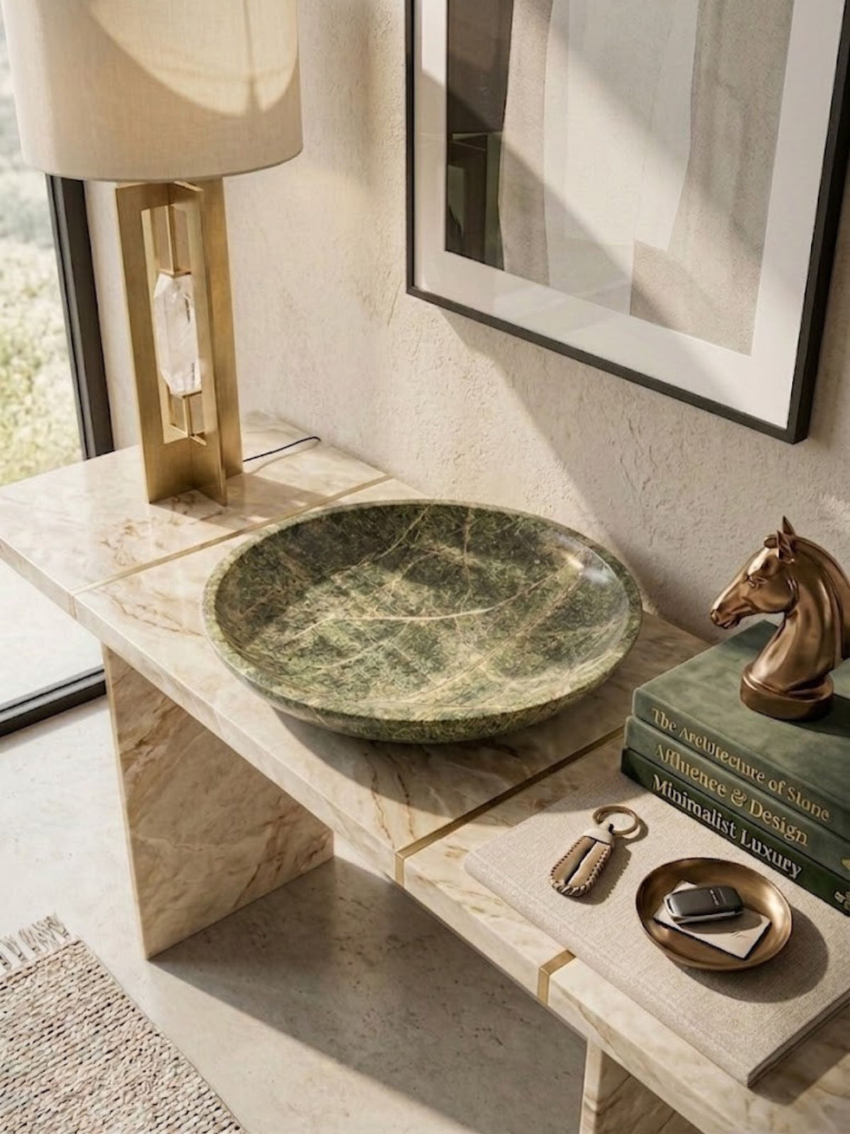 Green marble bowl styled on a console.
