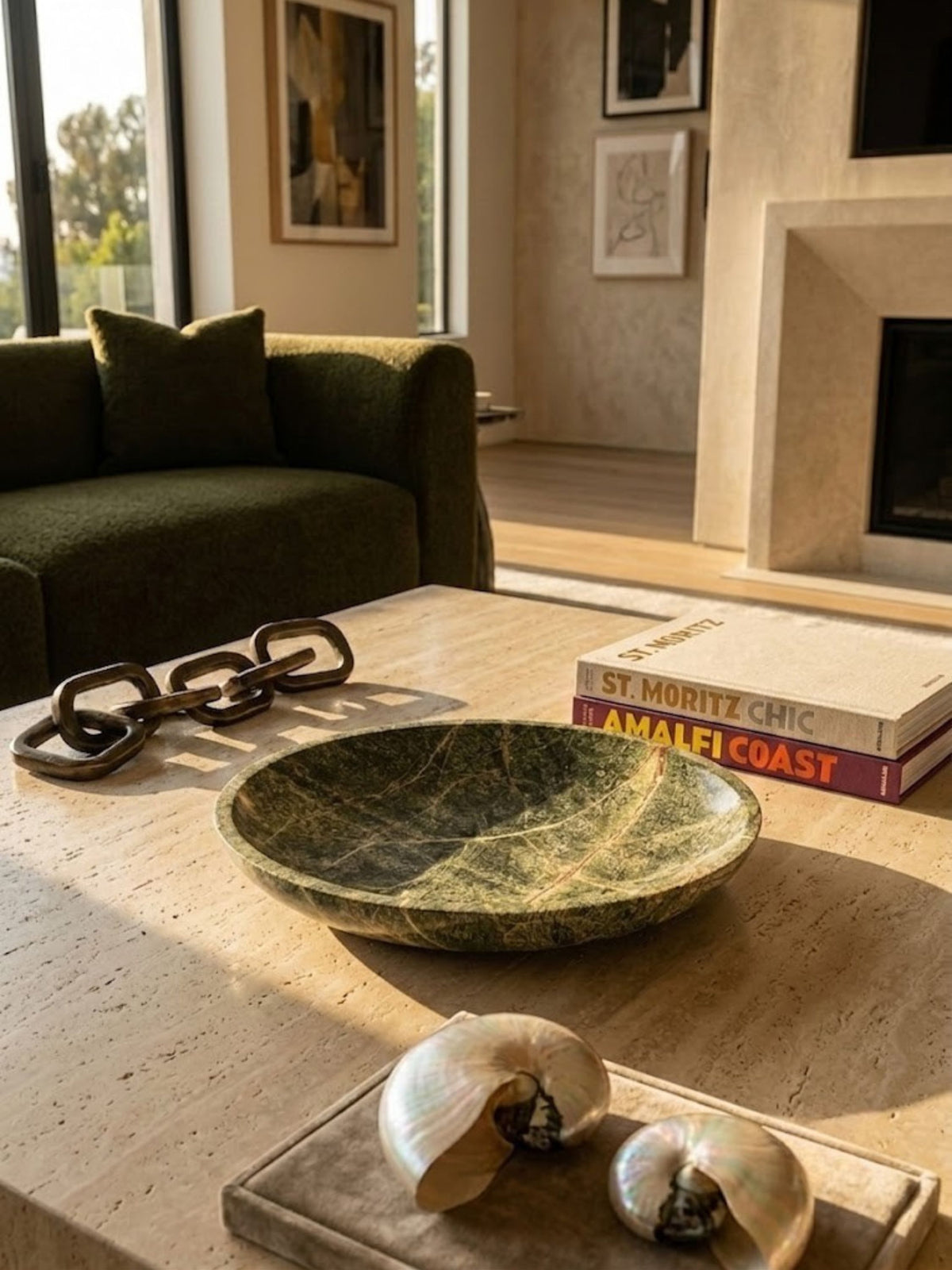 Green marble bowl with a wide silhouette, styled in an interior setting.
