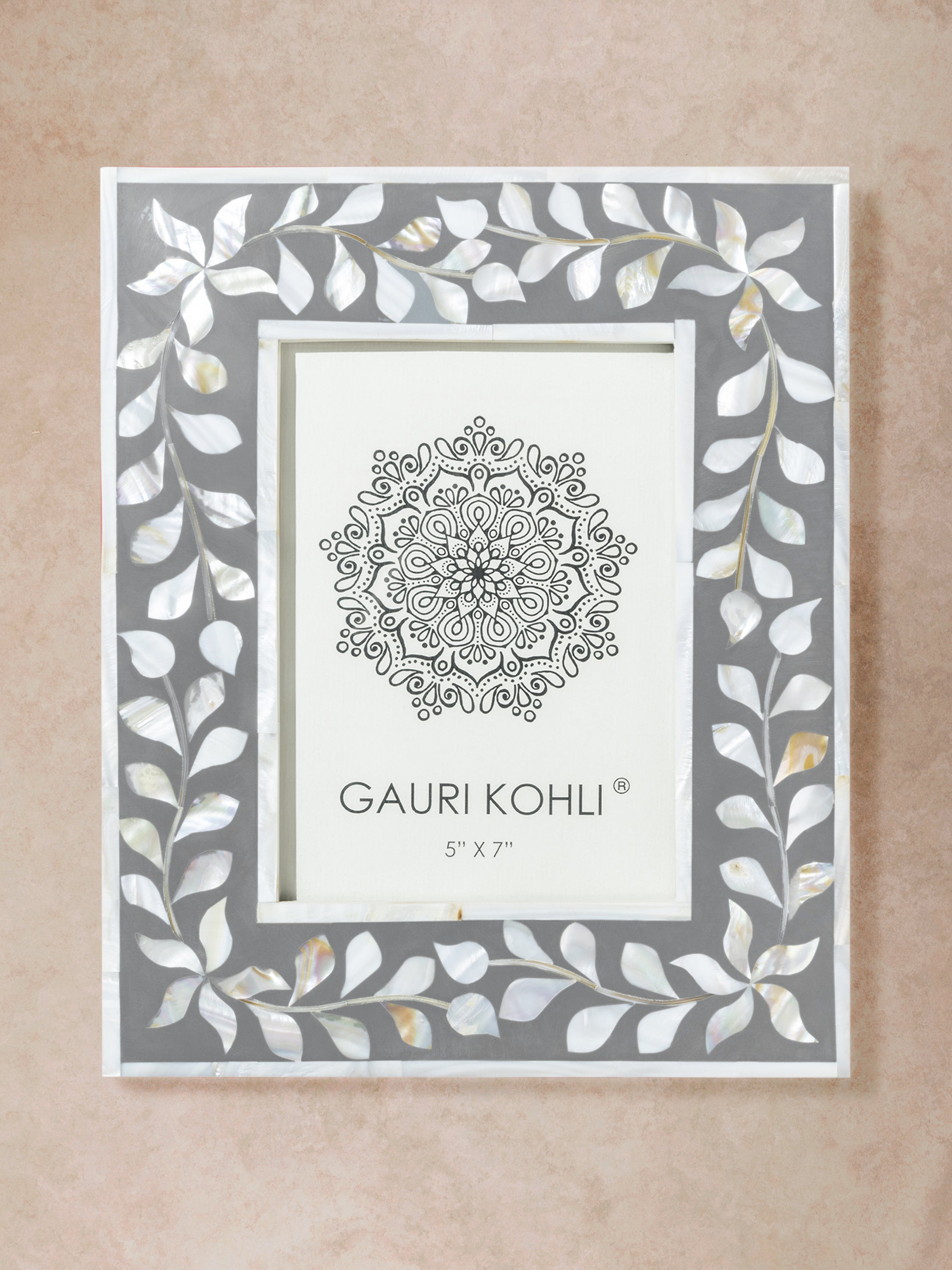 Rectangular picture frame with grey and ivory bone inlay featuring repeating vine border and clean inner margin in a front-facing composition