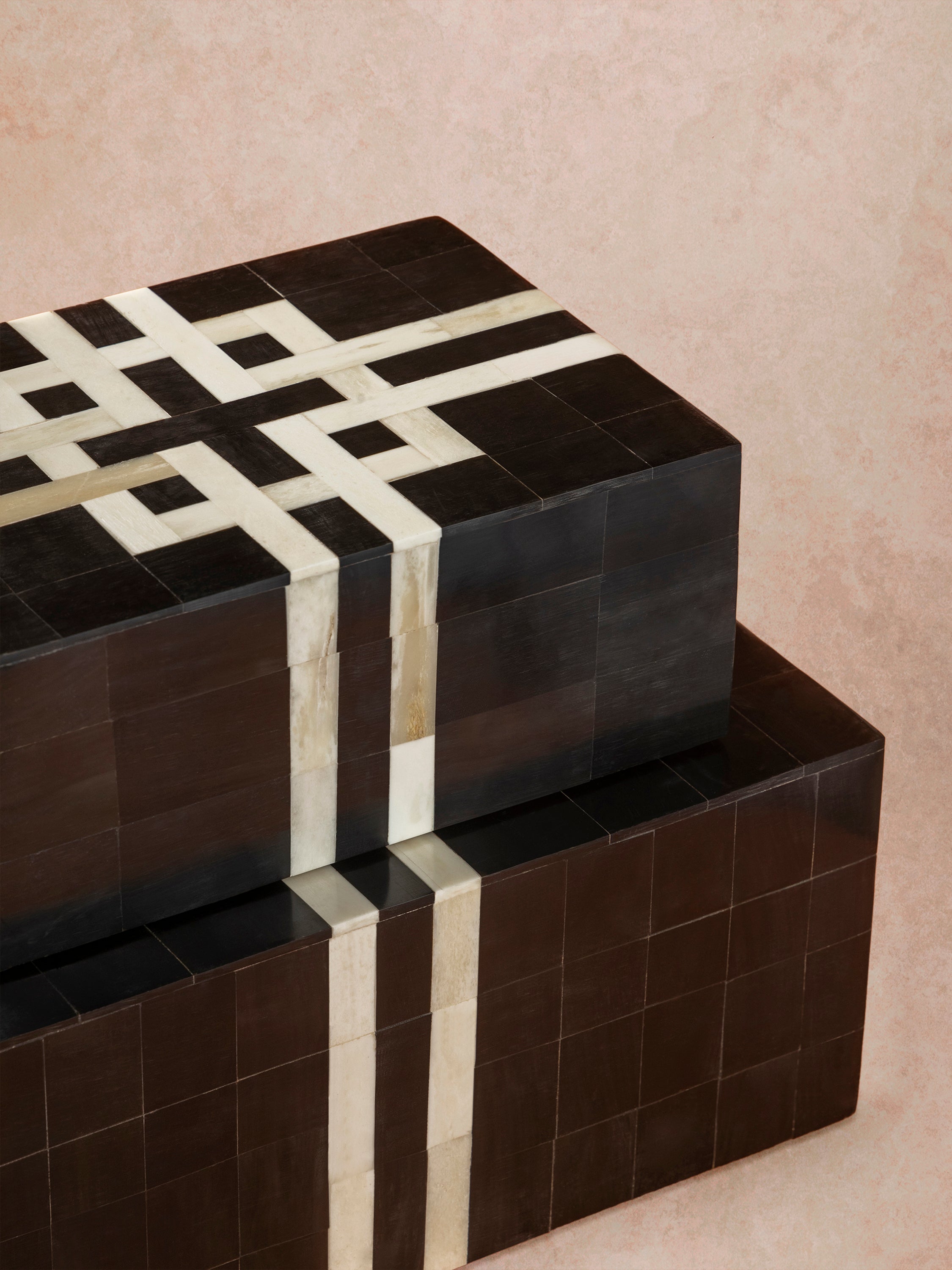 Close-up of decorative box showing precise inlay grid, smooth polished finish, and contrast between dark horn and light bone segments